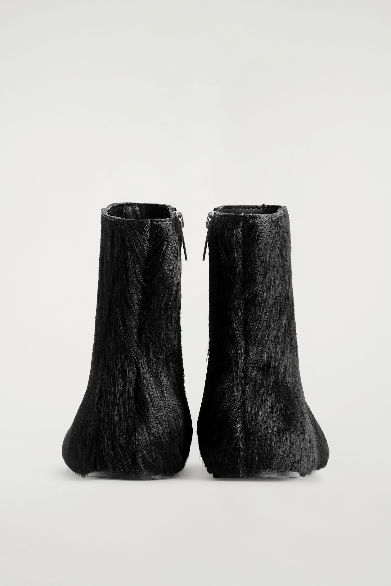 PONY HAIR-EFFECT LEATHER SOCK BOOTS — CARBON