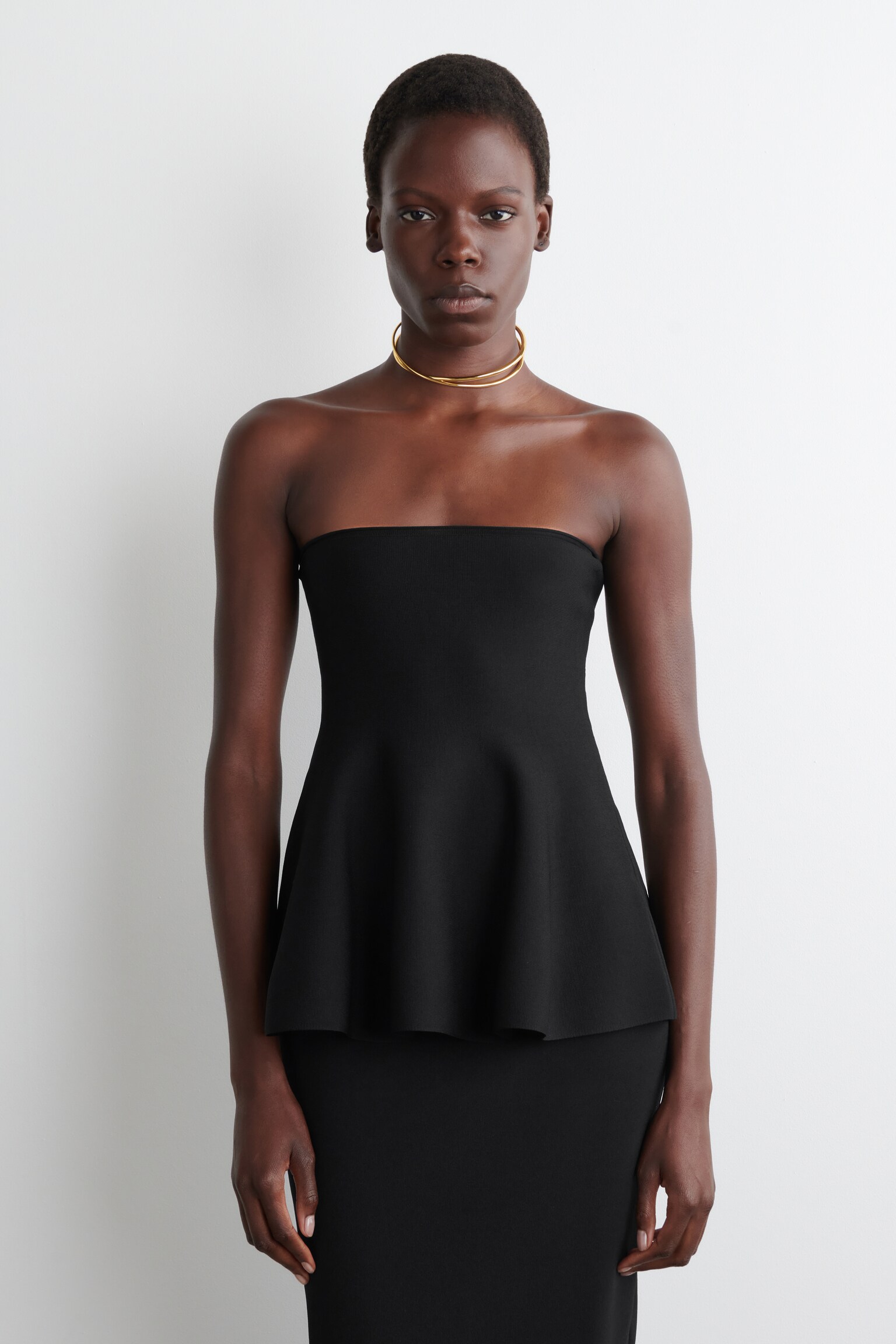 SHEER-DETAIL KNITTED PEPLUM TOP - BLACK