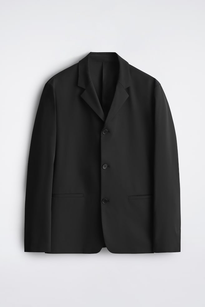 FIGURNÄRA OSTRUKTURERAD KAVAJ I TEKNISK TWILL - SVART - 1
