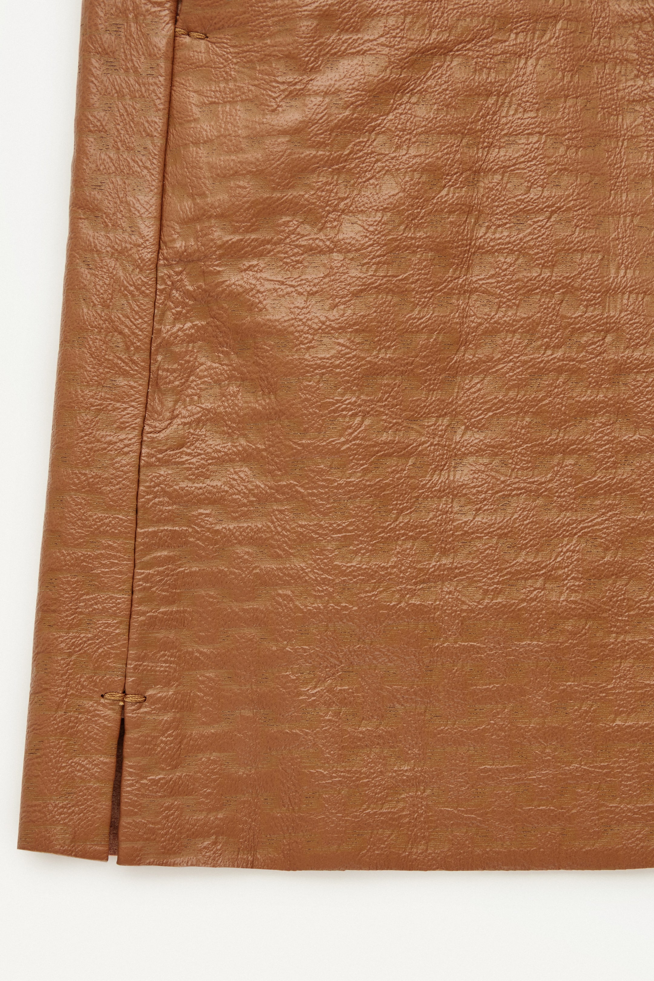 THE EMBOSSED-LEATHER MINI SKIRT
