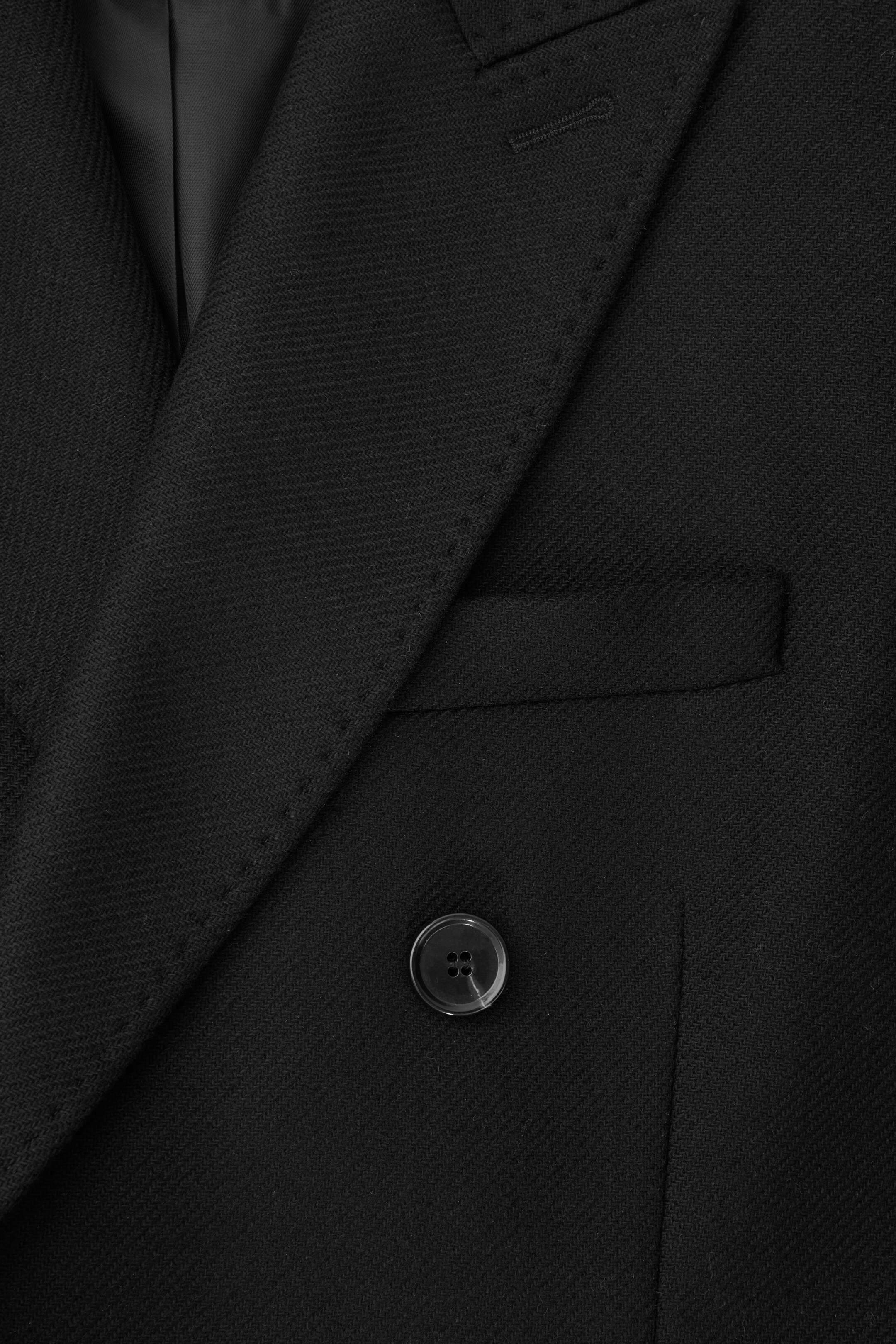 Grotere afbeelding bekijken: OVERSIZED DOUBLE-BREASTED WOOL COAT - BLACK - DAMES | H&M NL 2