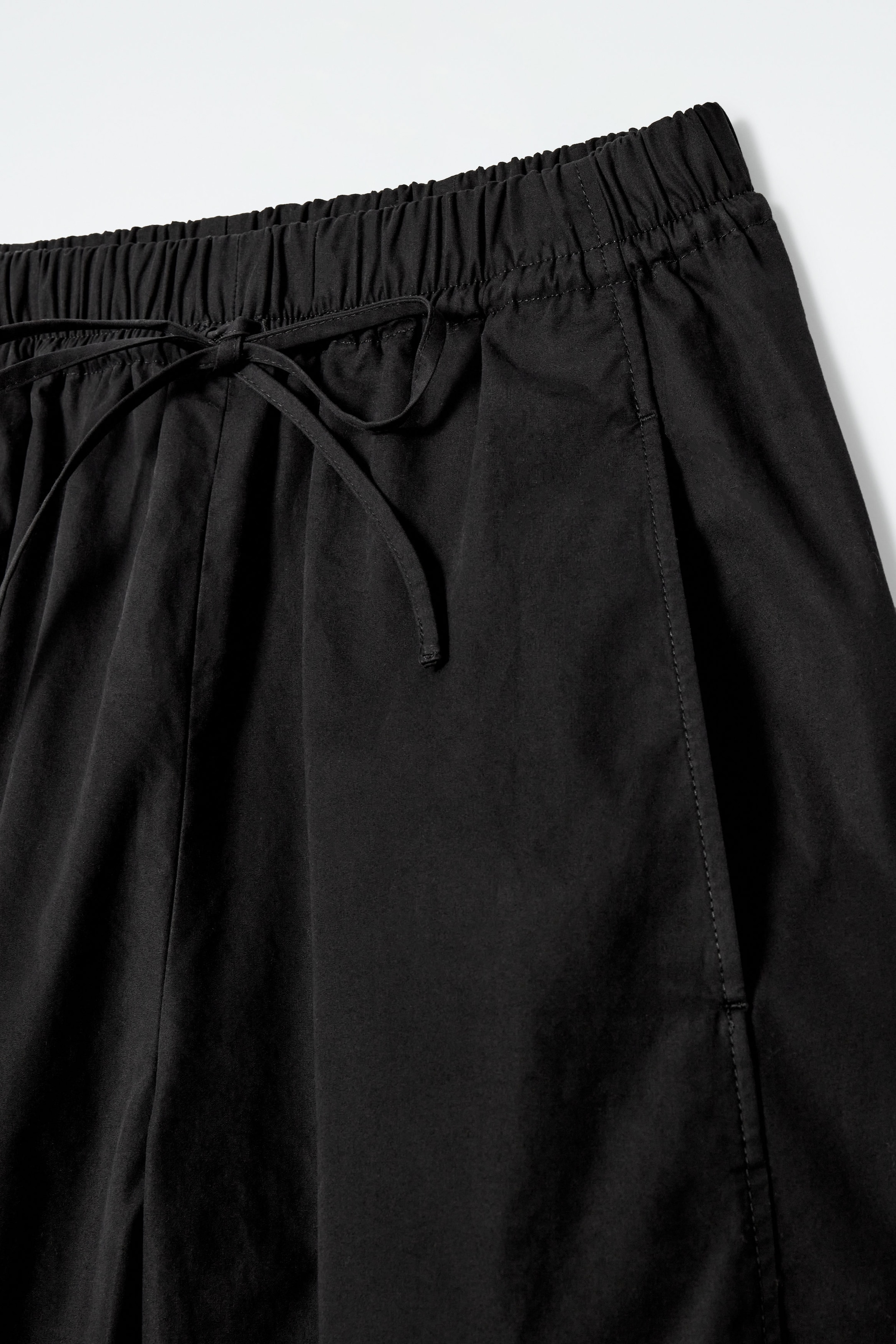 ELASTICATED BARREL-LEG TROUSERS