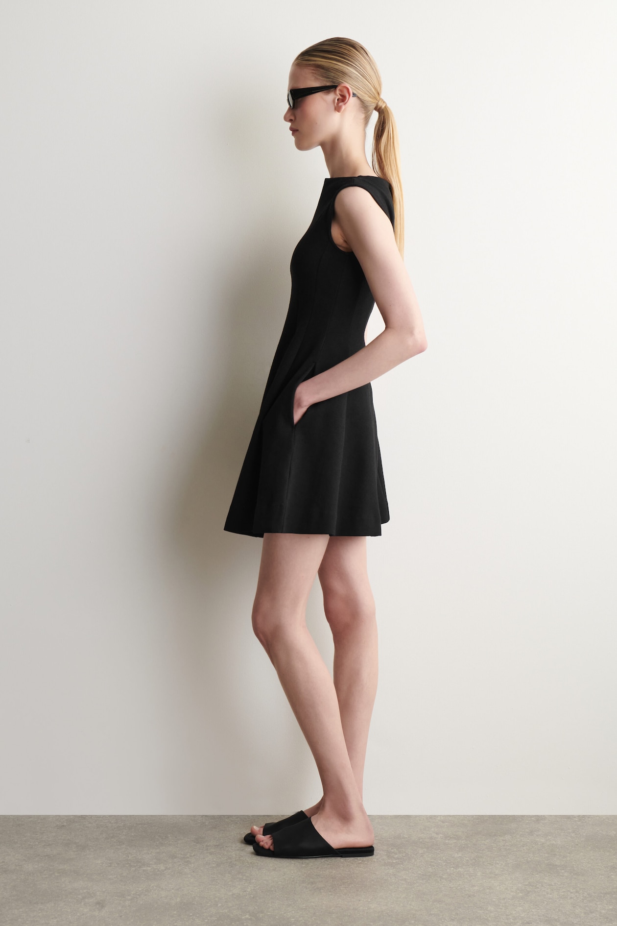 SCULPTED FLARED COTTON MINI DRESS — BLACK