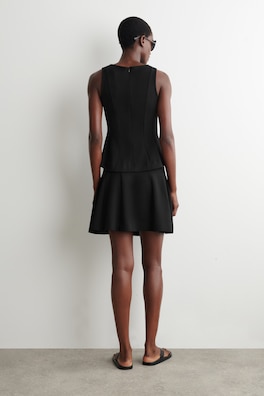 SCULPTED PANELED JERSEY MINI SKIRT — BLACK 4