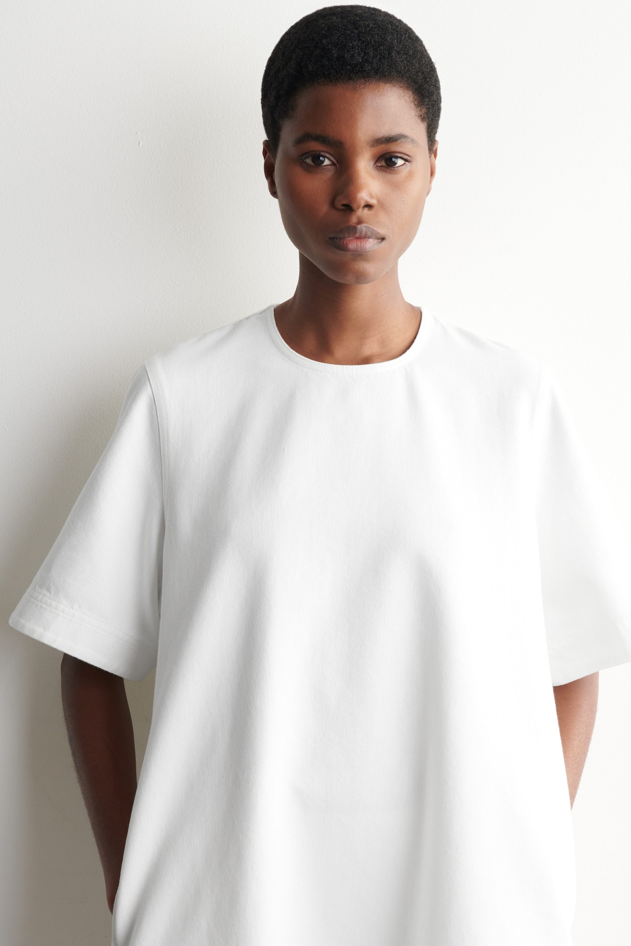 FLARED DENIM MINI DRESS — WHITE