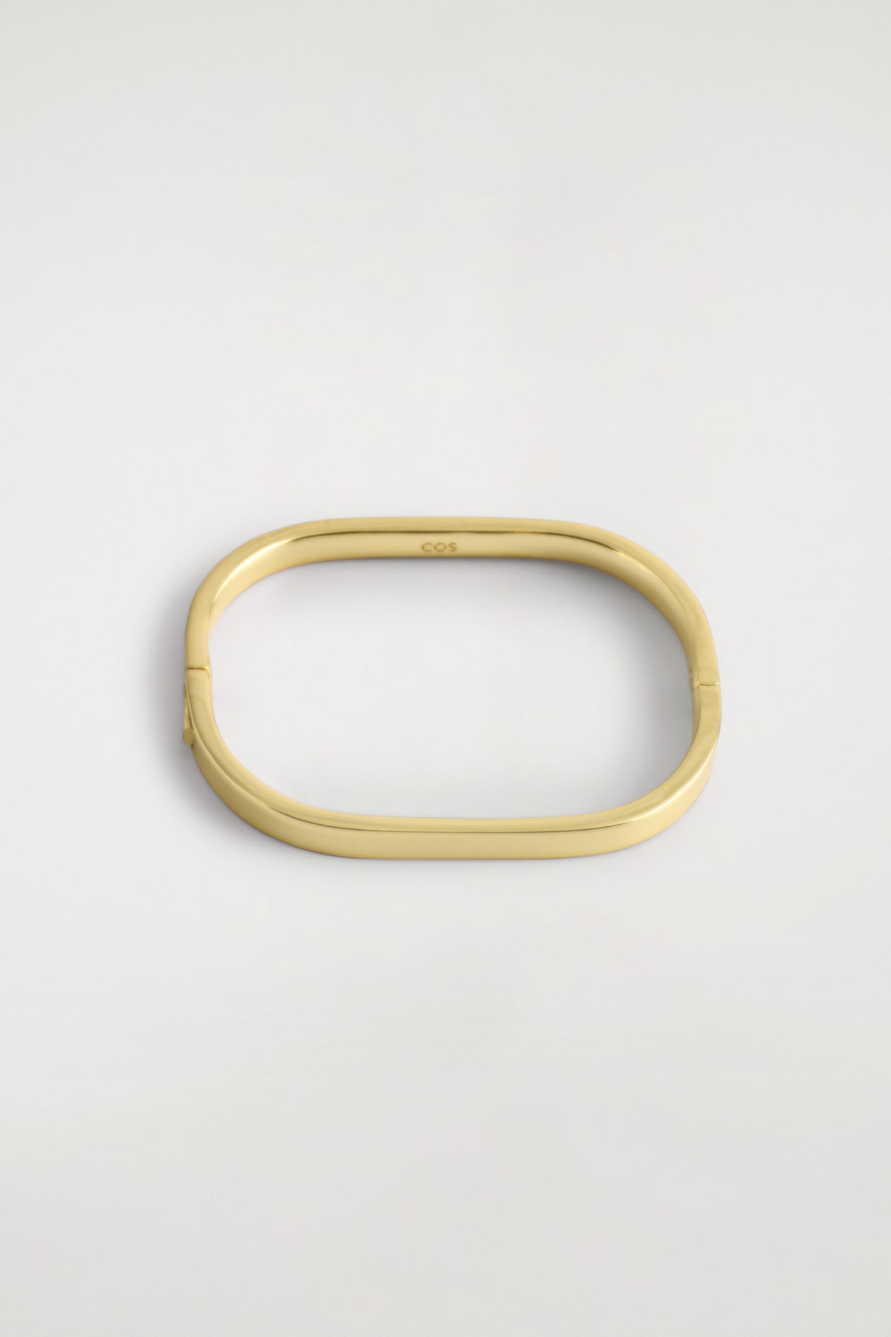 CURVED RECTANGULAR BANGLE — GOLD