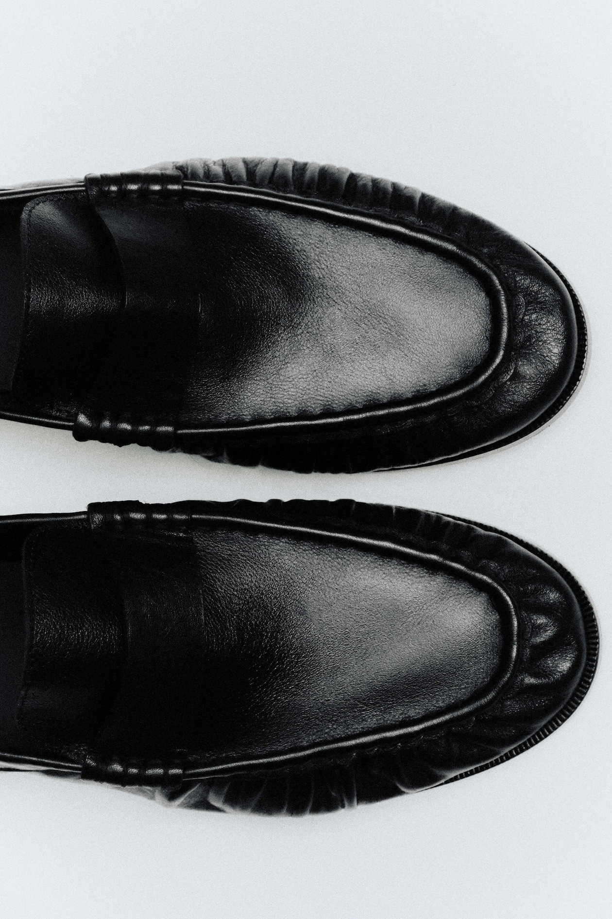 RUCHED LEATHER LOAFERS — BLACK