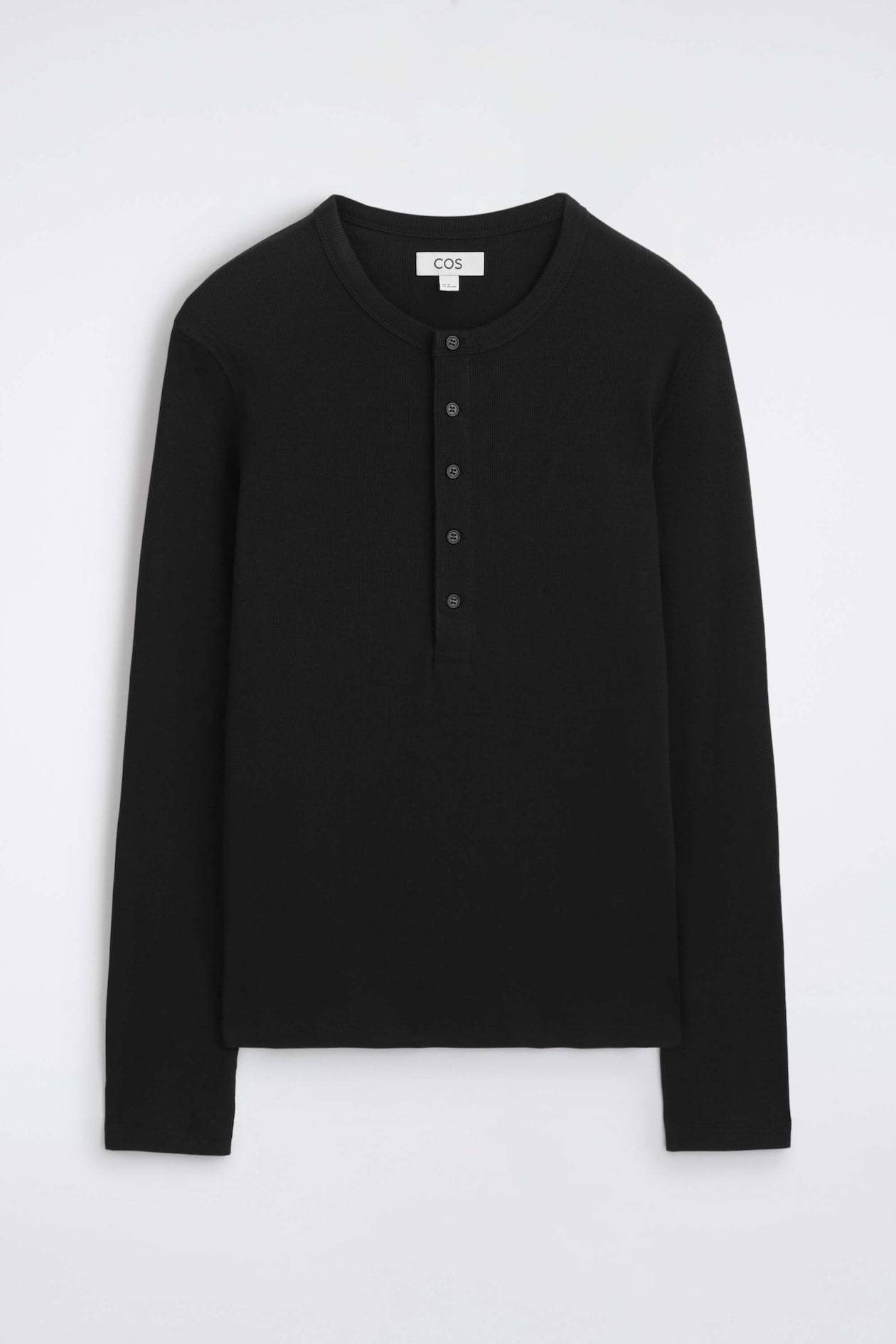 A black, slim-fit, ribbed cotton long-sleeved Henley T-shirt is laid flat, showing the front design. The garment features a crew neckline with a vertical five-button placket and a fine ribbed texture throughout the body and sleeves.