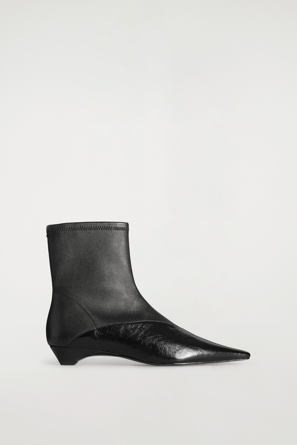 PANELED POINTED LEATHER WEDGE ANKLE BOOTS — BLACK