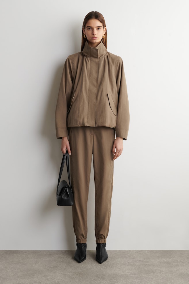 TECHNICAL NYLON BARREL-LEG TROUSERS — BEIGE