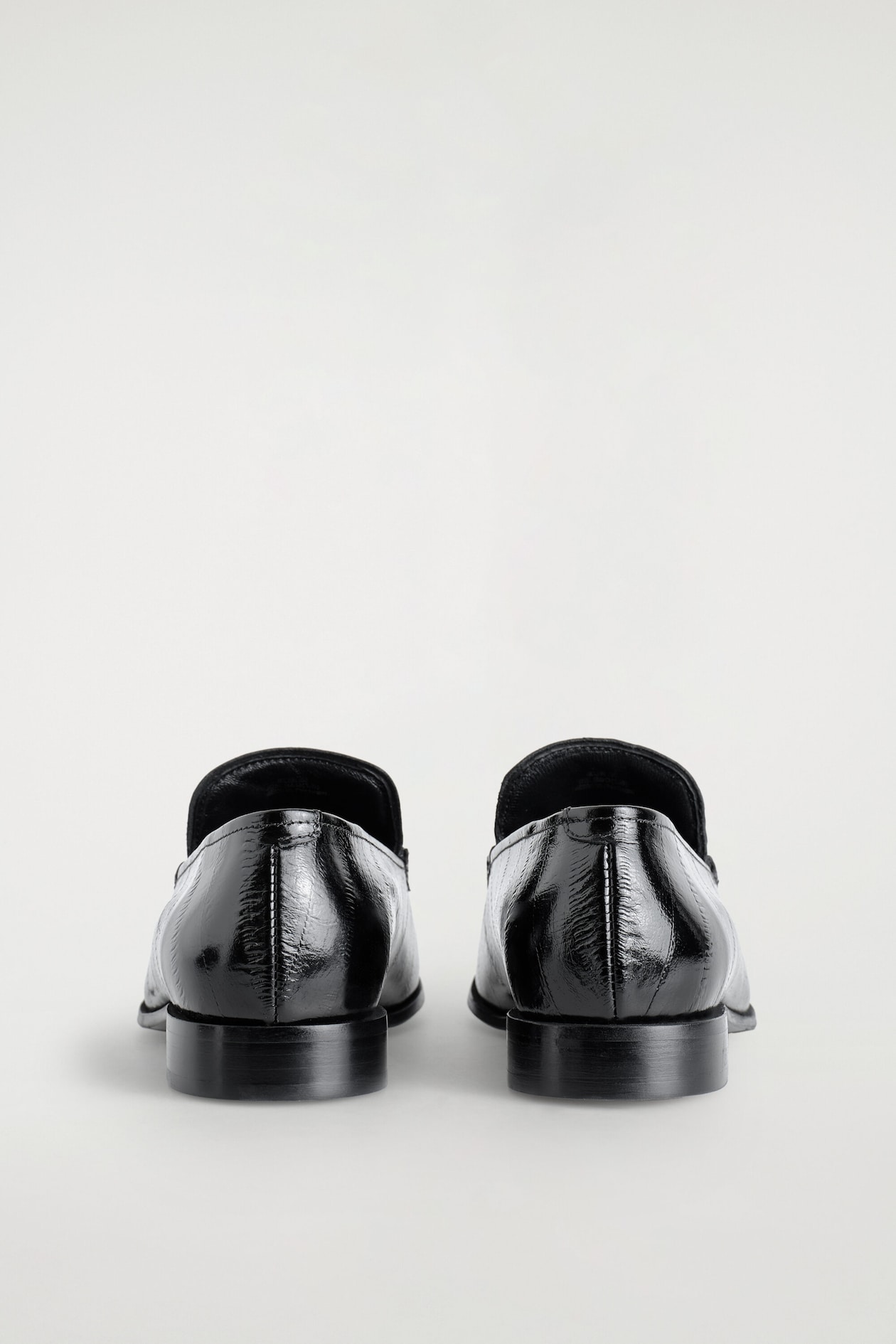 EEL-EFFECT LEATHER LOAFERS — BLACK