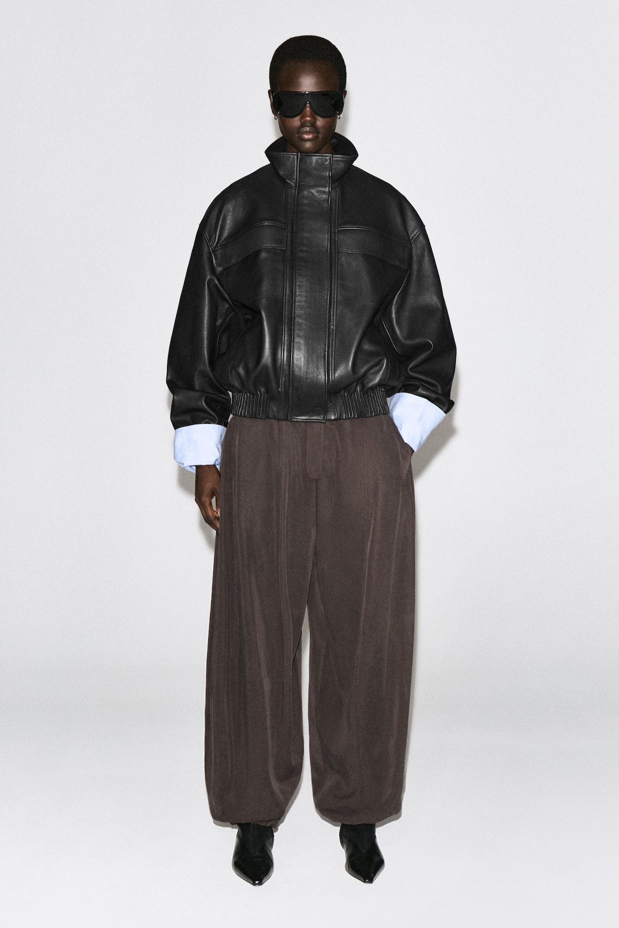 LEATHER MOCK-NECK BOMBER JACKET — BLACK
