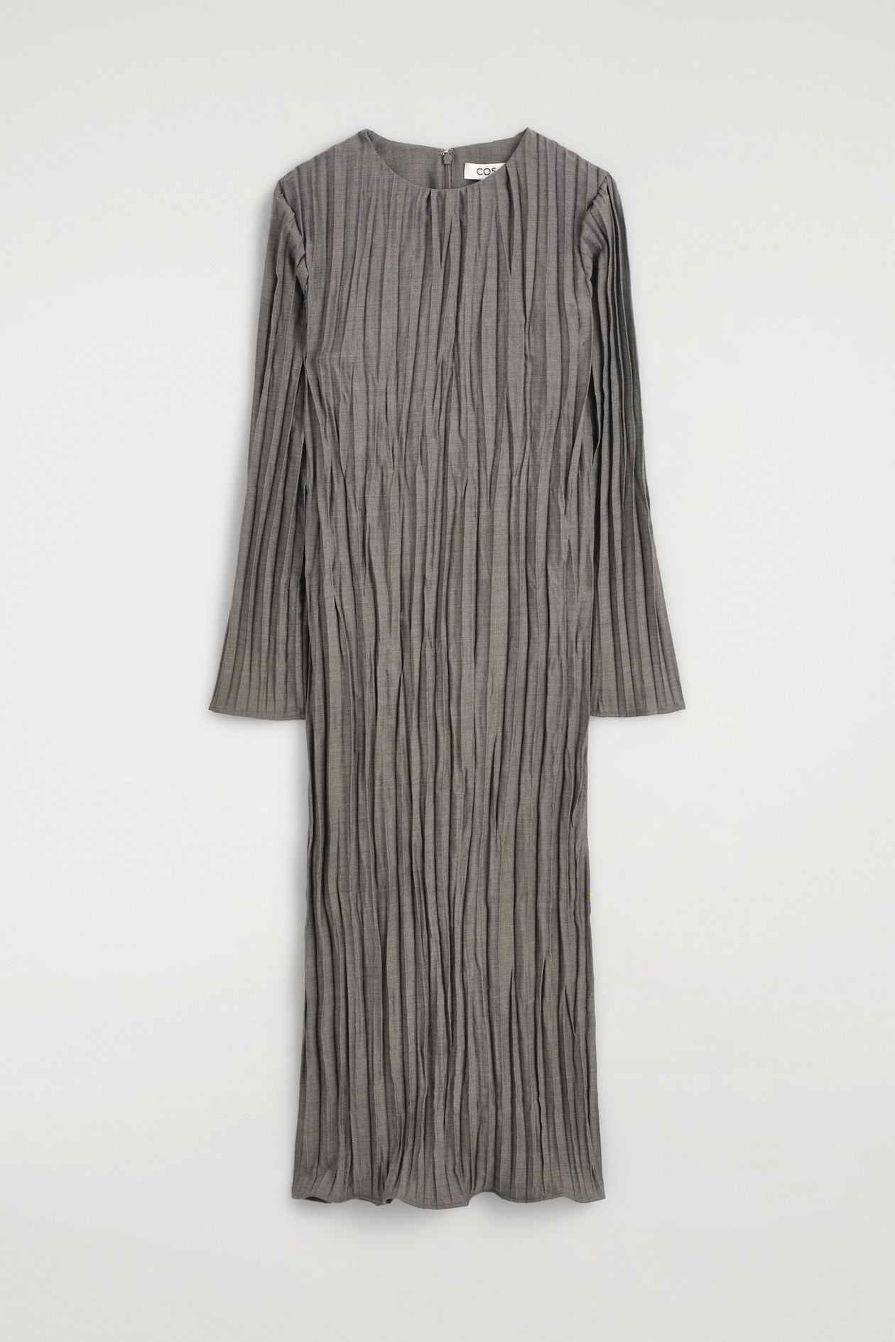 A gray midi dress facing forward showcases vertical plissé pleating throughout the entire body and long sleeves. It features a round neckline with a small center slit and a straight, relaxed silhouette.