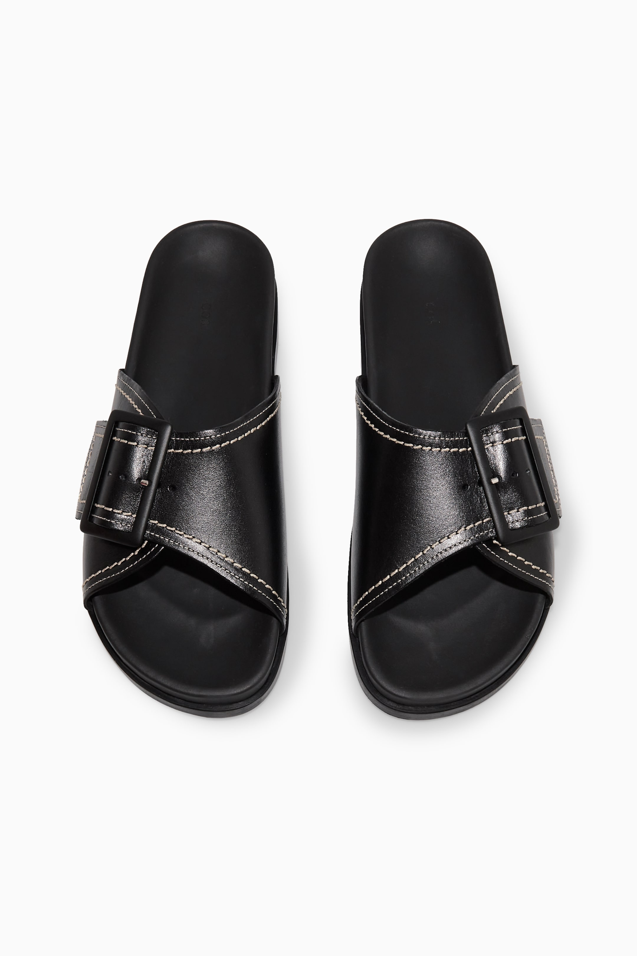 Grösseres Bild ansehen: LEDER-PANTOLETTEN MIT SCHNALLE UND KONTRASTNÄHTEN - SCHWARZ/WEISS - DAMEN | H&M CH 2