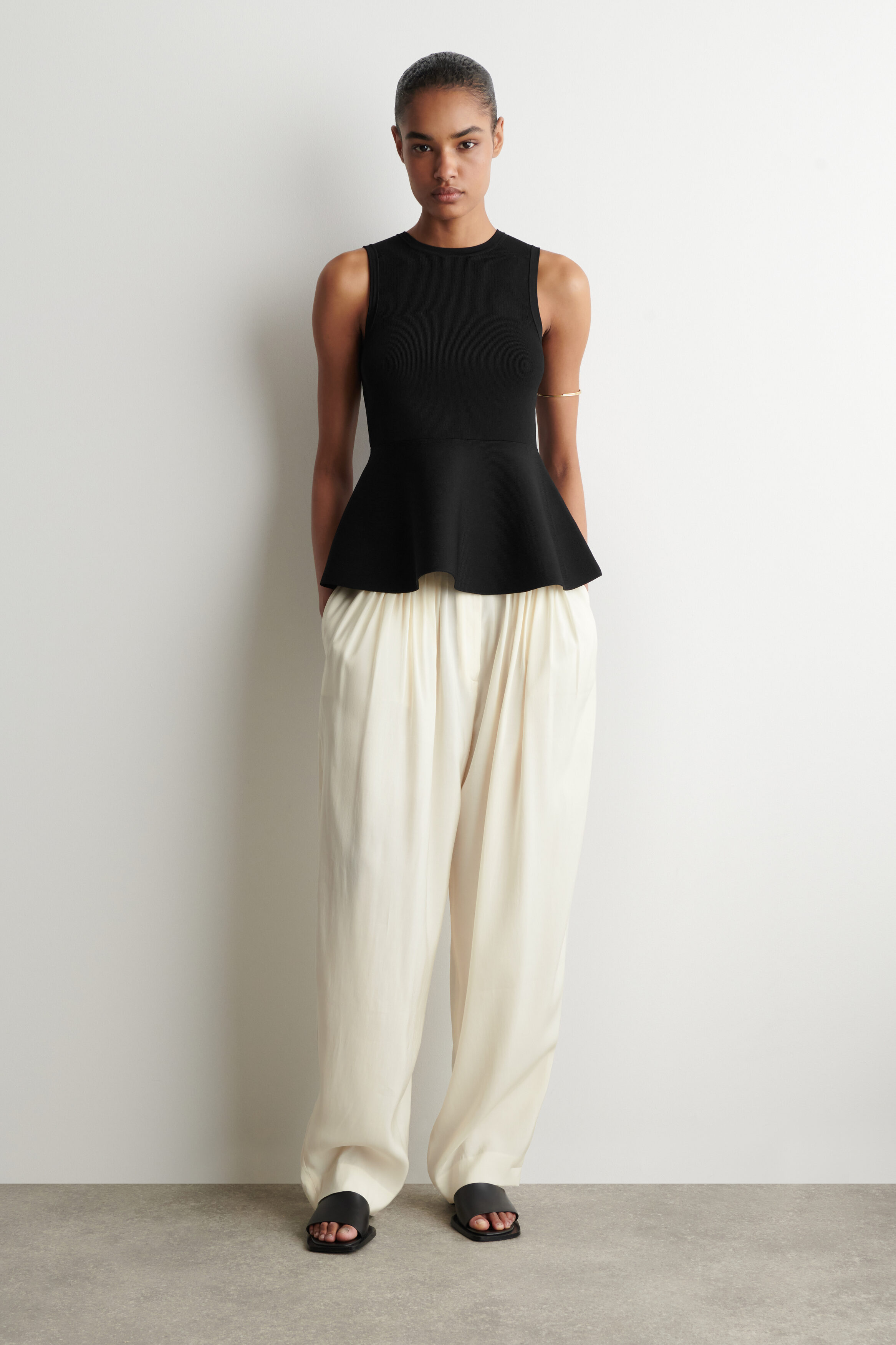 KNITTED PEPLUM TOP - BLACK | COS US