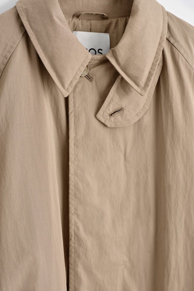 PADDED BELTED FUNNEL-NECK LONG COAT — BEIGE
