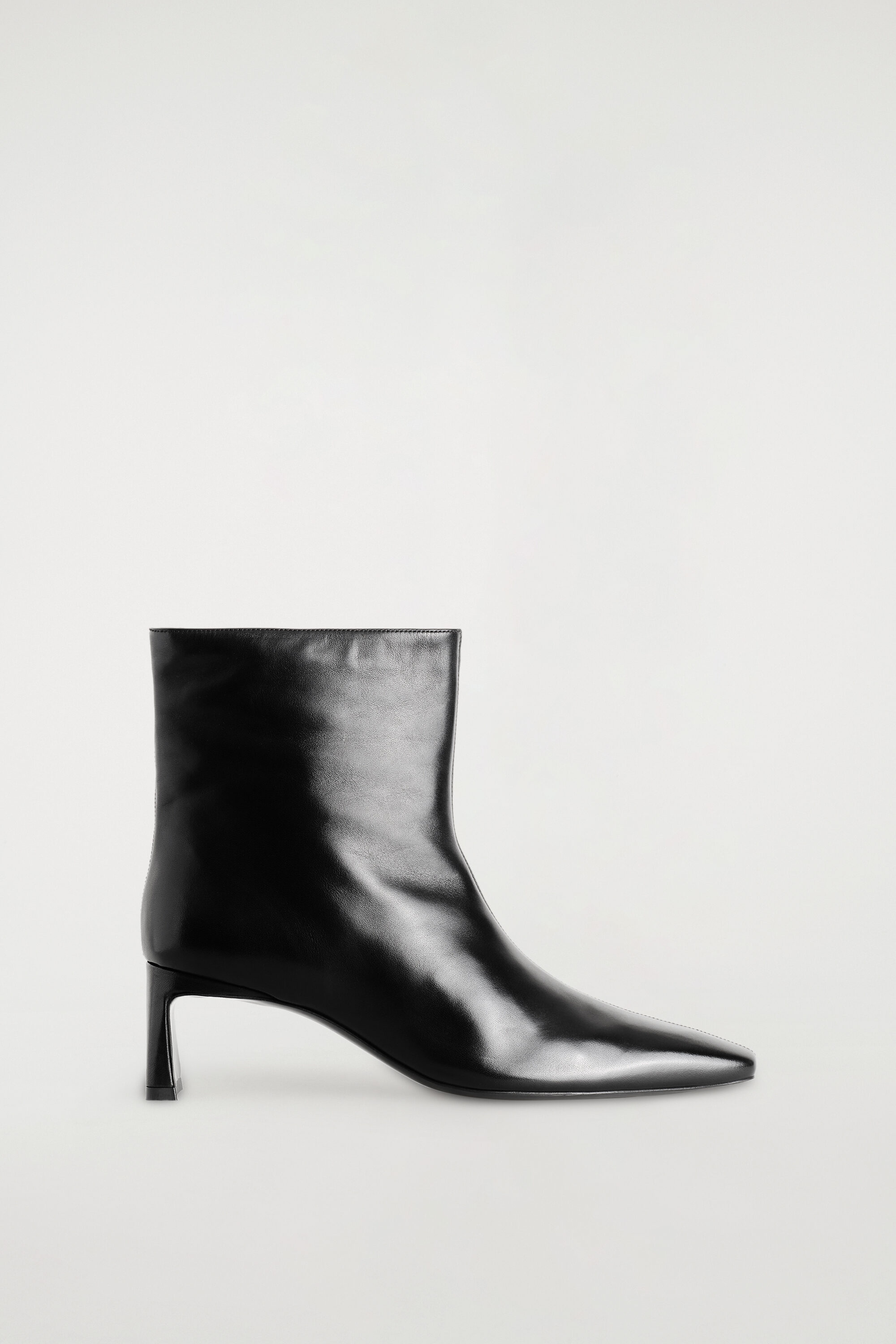ANGULAR LEATHER HEELED ANKLE BOOTS