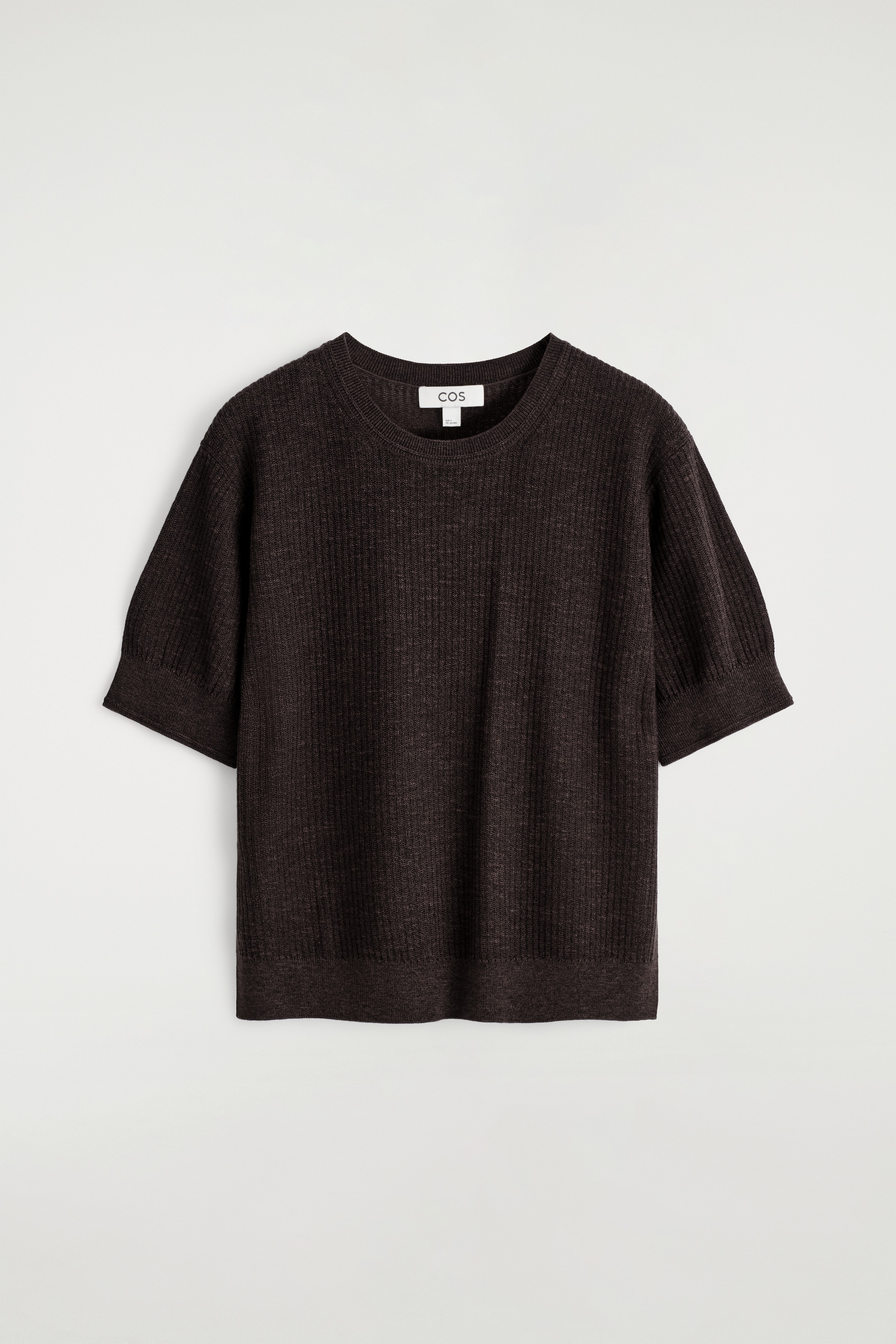 View larger image: A dark brown, rib-knit short-sleeved top is being shown from the FRONT. It is featuring a round neck, short sleeves with subtle gathering at the shoulders and ribbed cuffs, and a ribbed hem.
