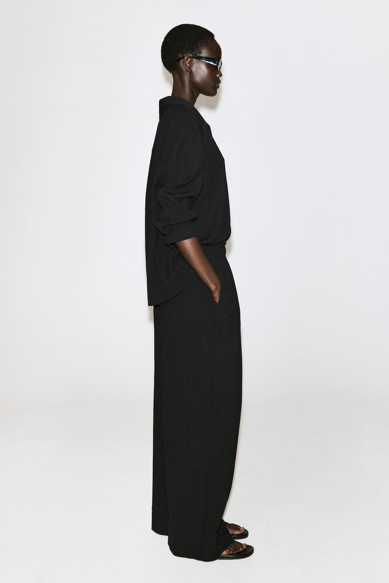 CRINKLED-JERSEY WIDE-LEG TROUSERS — BLACK