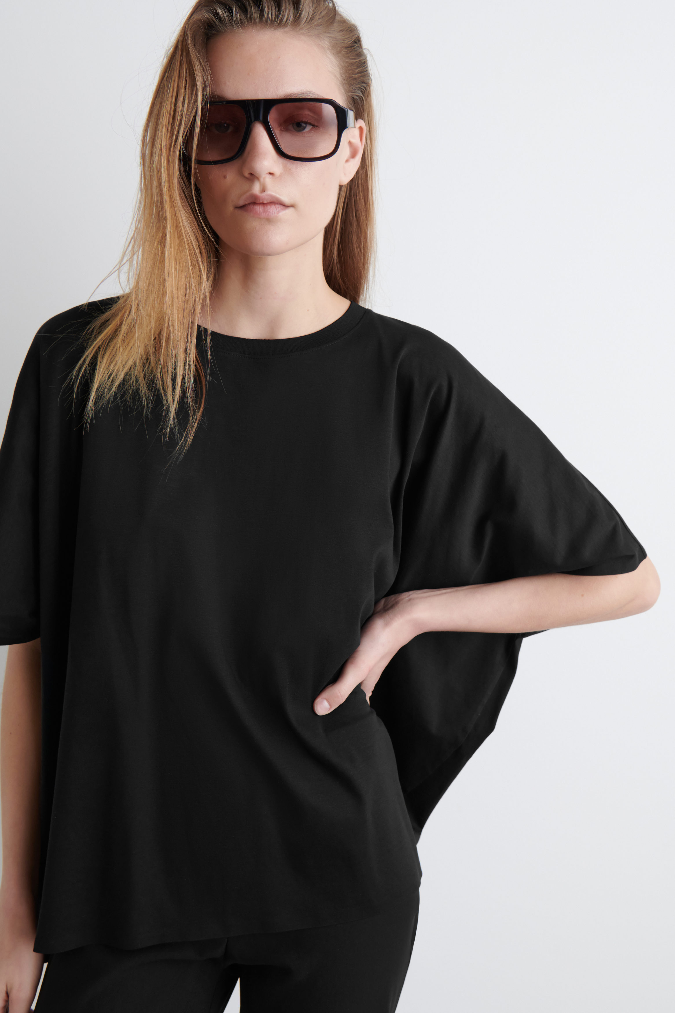 OVERSIZED BATWING-SLEEVE T-SHIRT - BLACK | COS