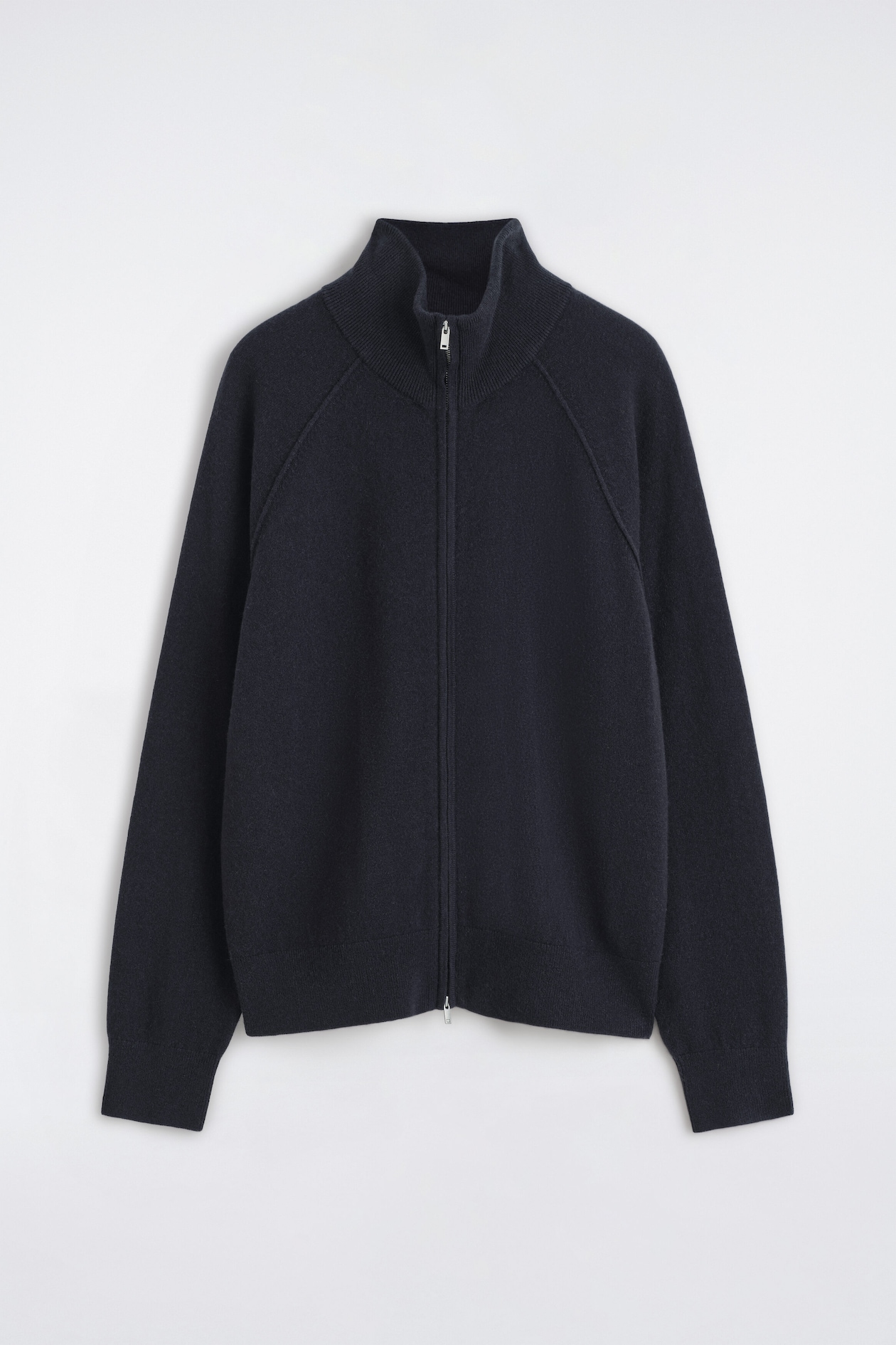 This cashmere funnel-neck zip-up cardigan is shown from the front, featuring a high ribbed collar, raglan sleeves, and a full-length silver-tone zip. The dark navy knitted garment is shown with ribbed cuffs and a matching ribbed hem.