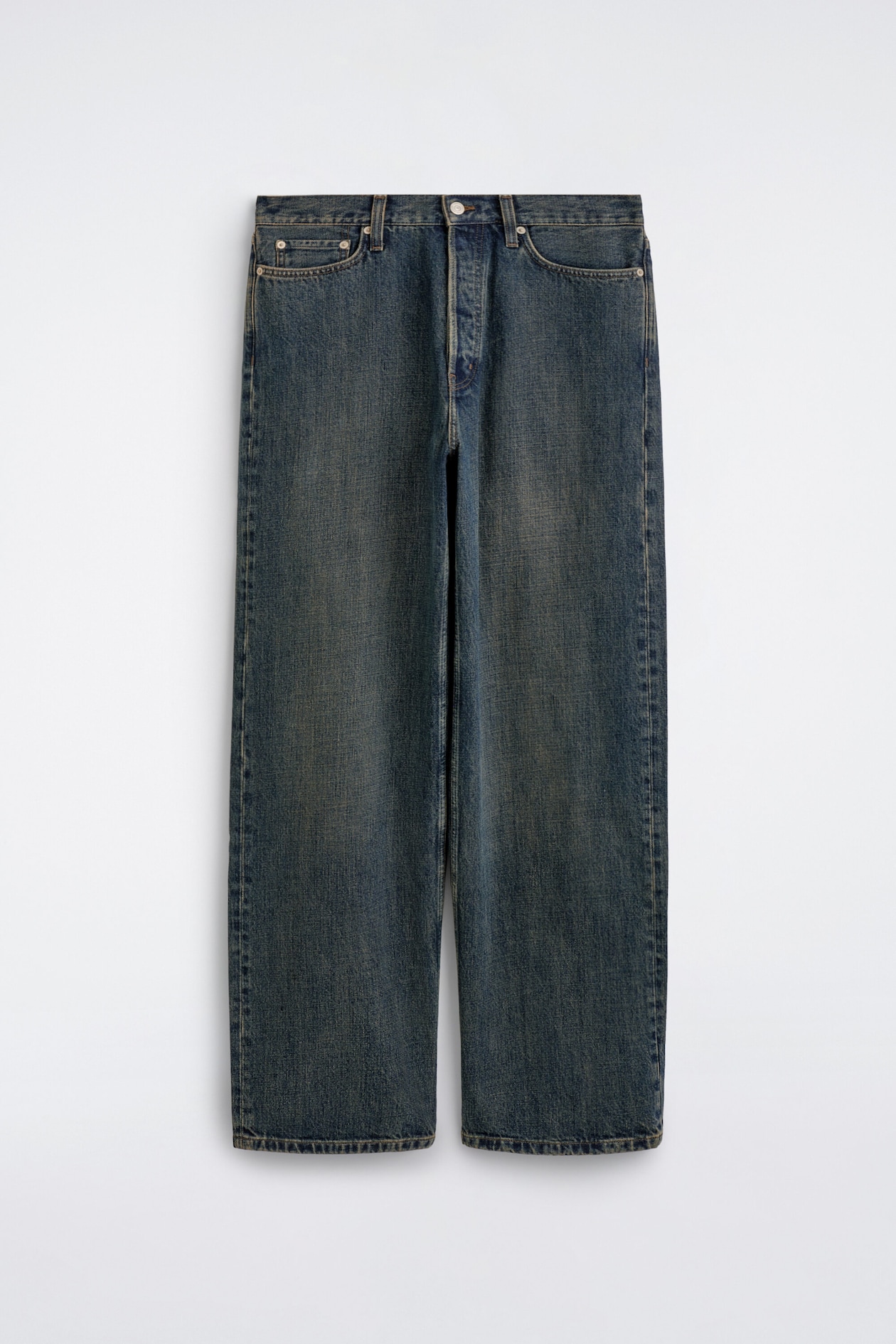 A pair of wide-leg denim jeans in a faded blue wash hangs facing front, displaying a relaxed, straight-leg silhouette with subtle vintage-style fading down the thighs. The jeans feature a classic five-pocket design, belt loops, and a button-fly closure.
