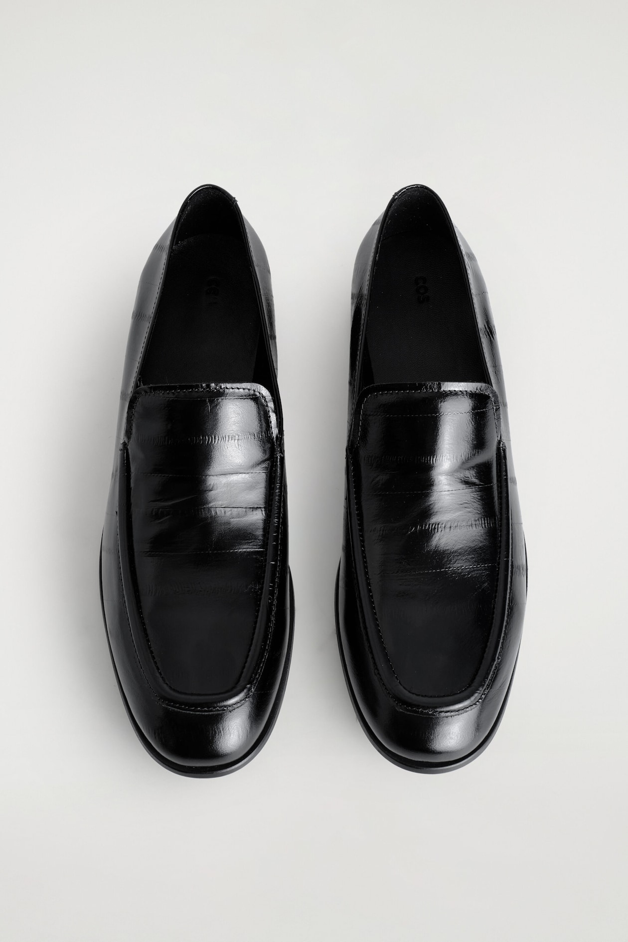 EEL-EFFECT LEATHER LOAFERS — BLACK
