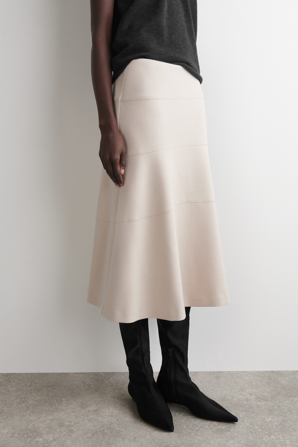 CURVED A-LINE MIDI SKIRT — LIGHT BEIGE