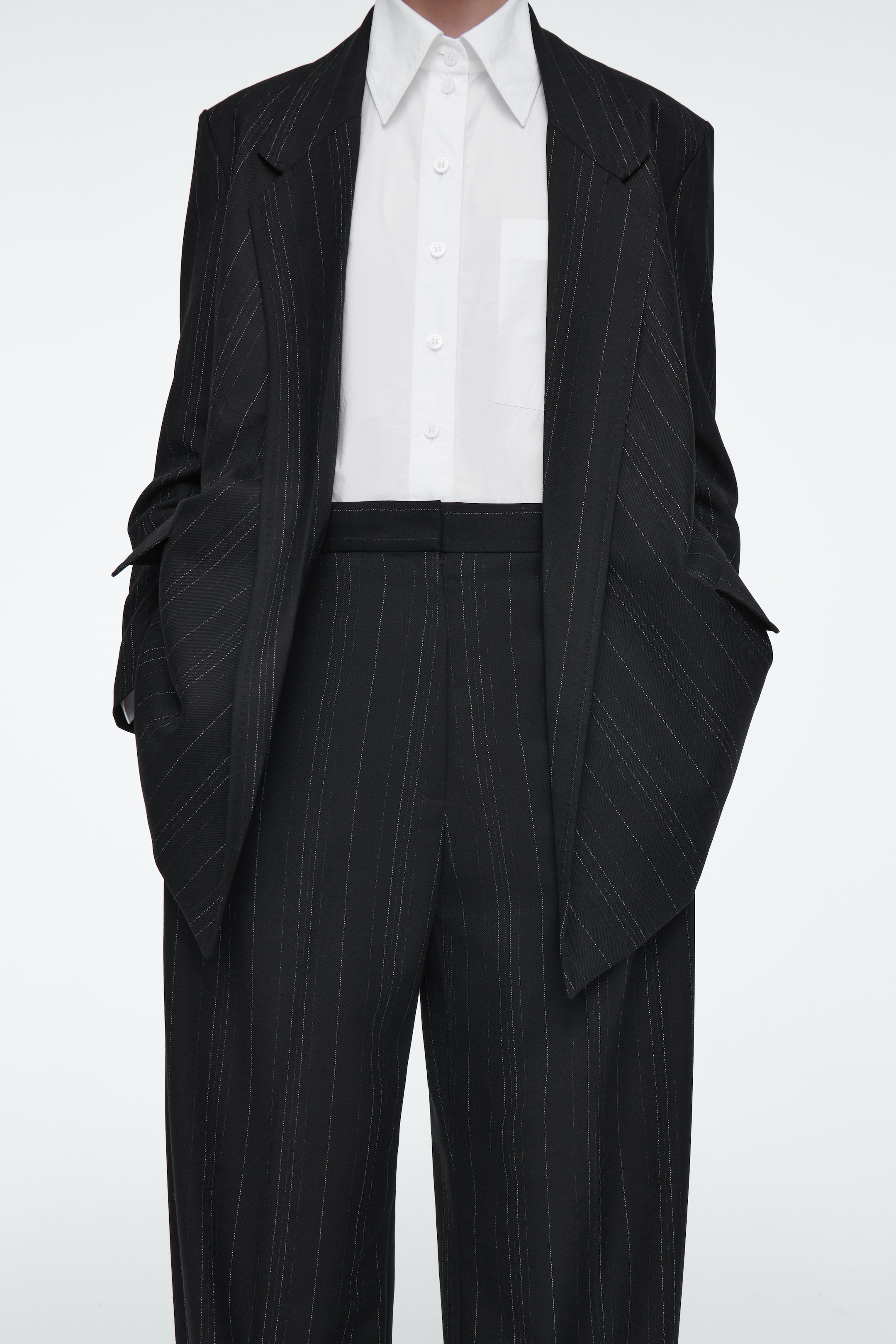 RELAXED PINSTRIPED BARREL-LEG TROUSERS