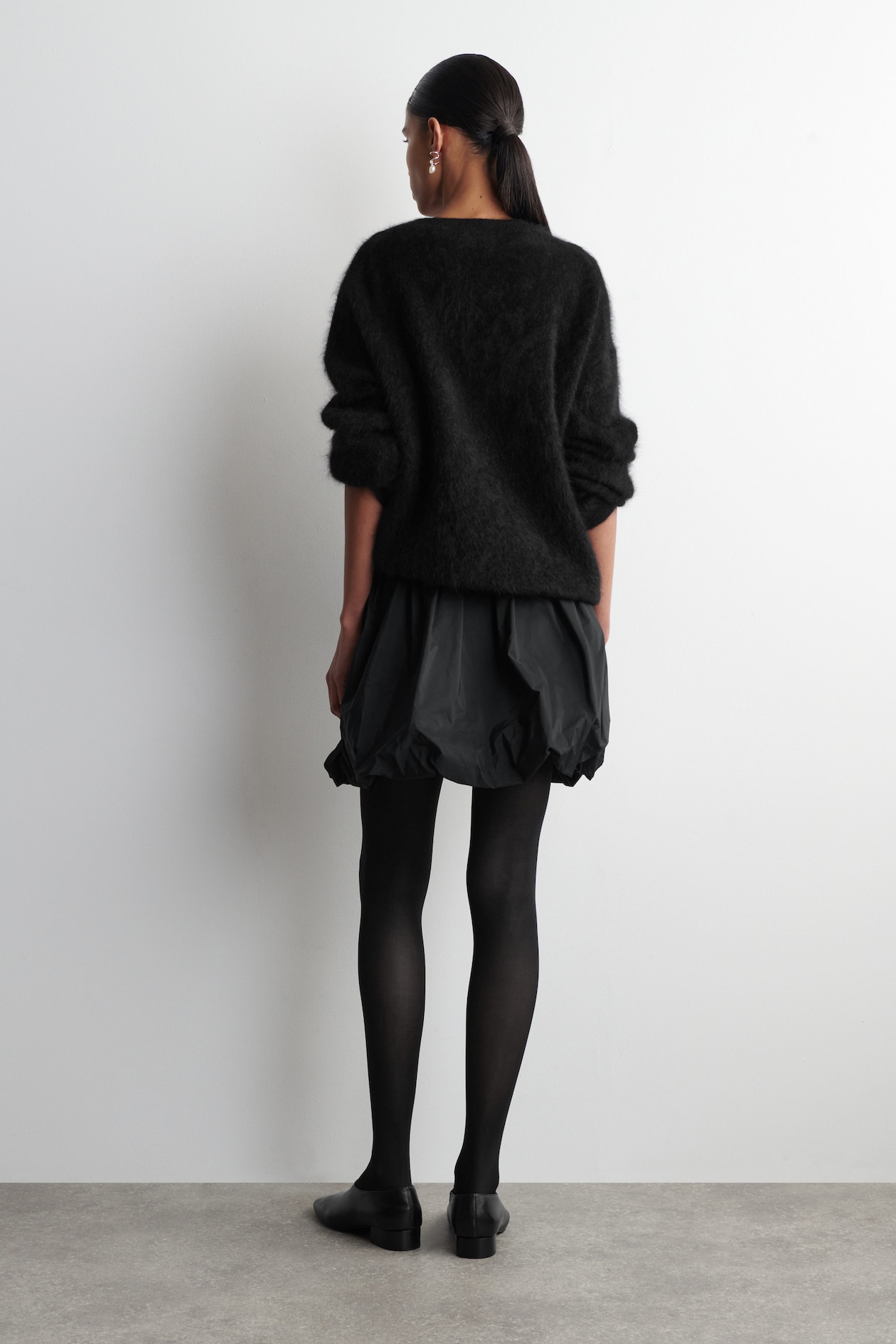 BUBBLE-HEM MINI SKIRT — BLACK