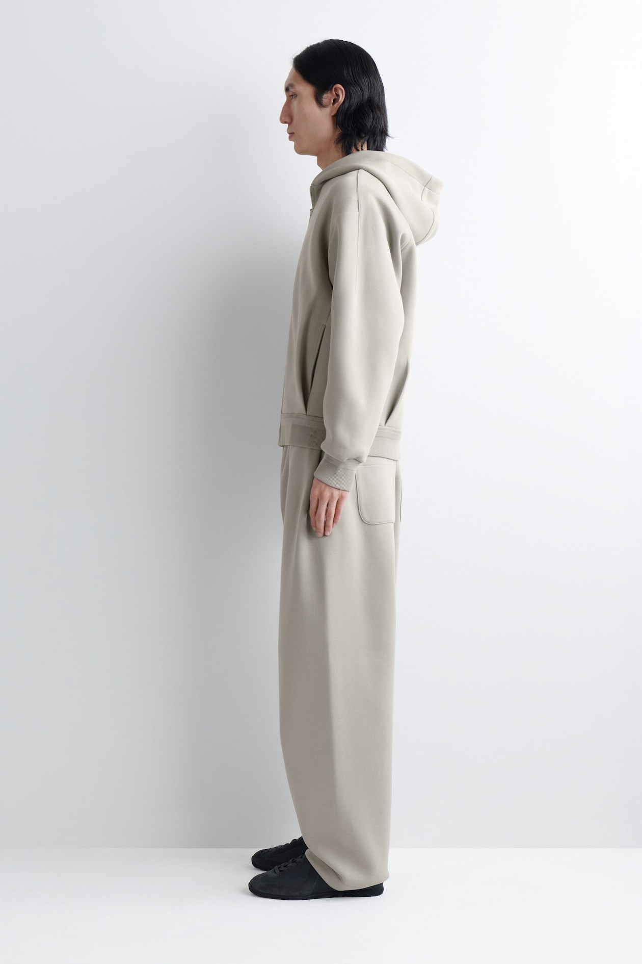 COTTON-PIQUÉ OVERSIZED BARREL-LEG JOGGERS — BEIGE
