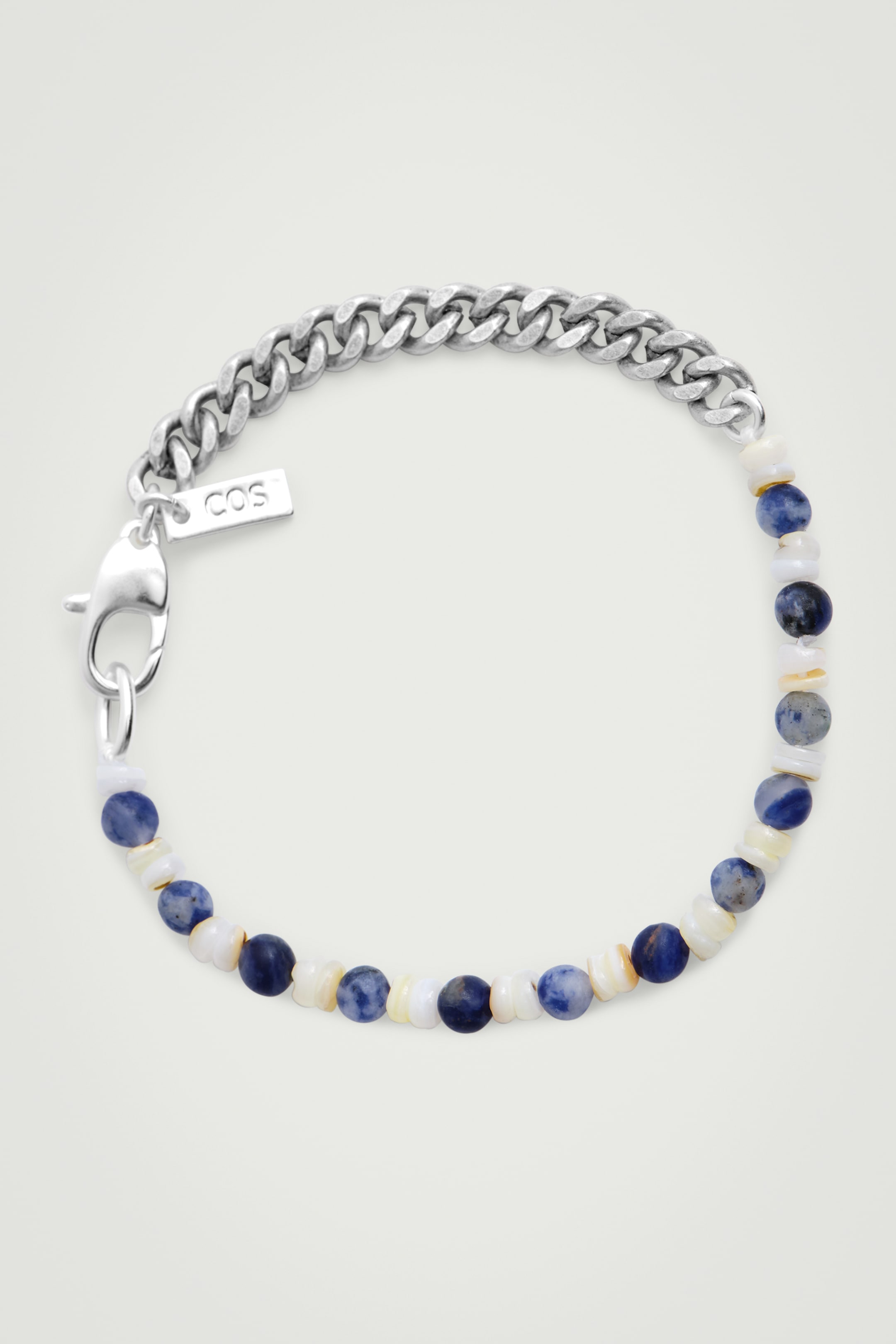 Grotere afbeelding bekijken: ARMBAND MET KETTING VAN HALFEDERE STEEN - WIT / BLAUW - HEREN | H&M BE 2