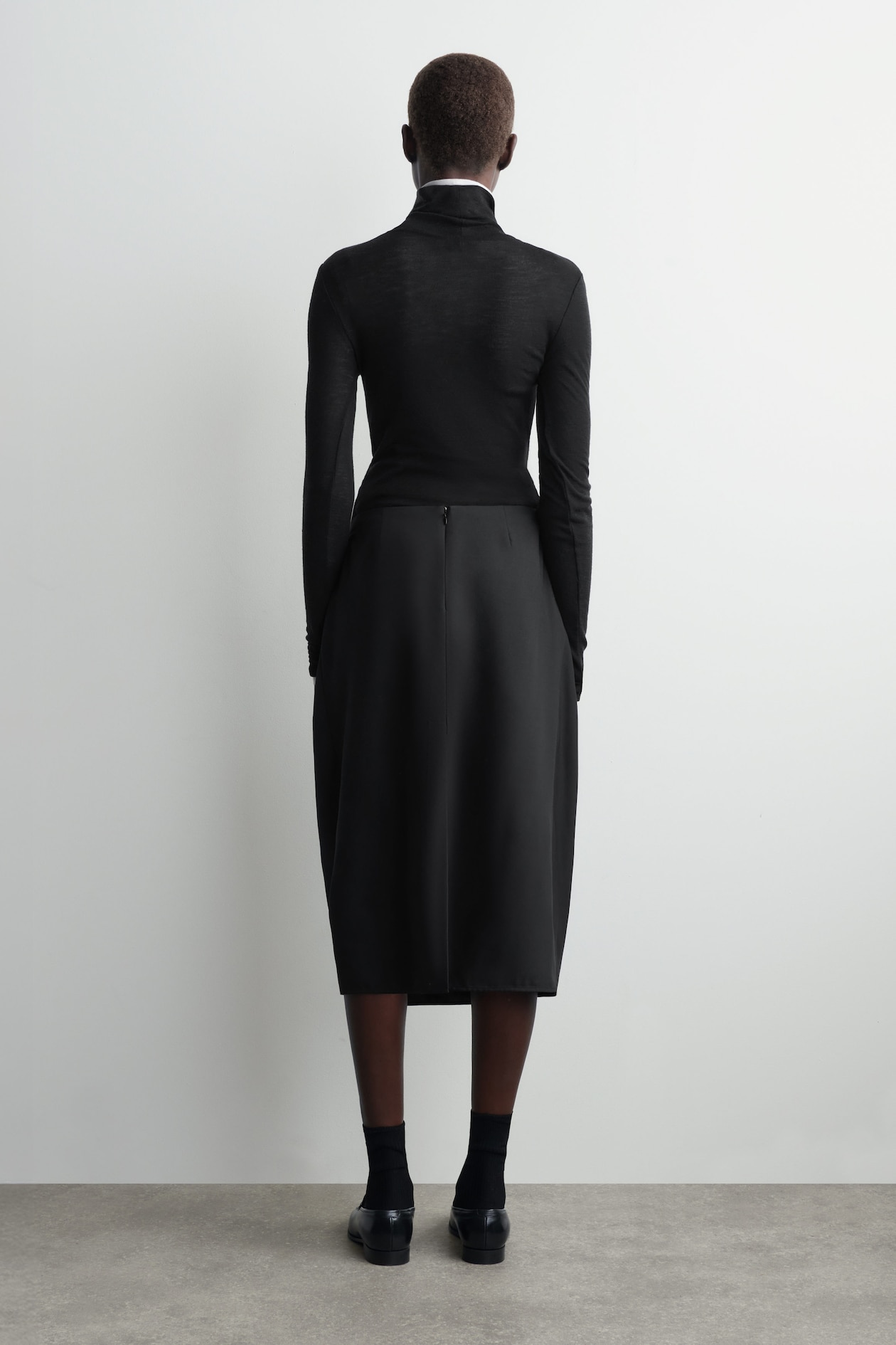 PLEATED WOOL MIDI TULIP SKIRT — BLACK