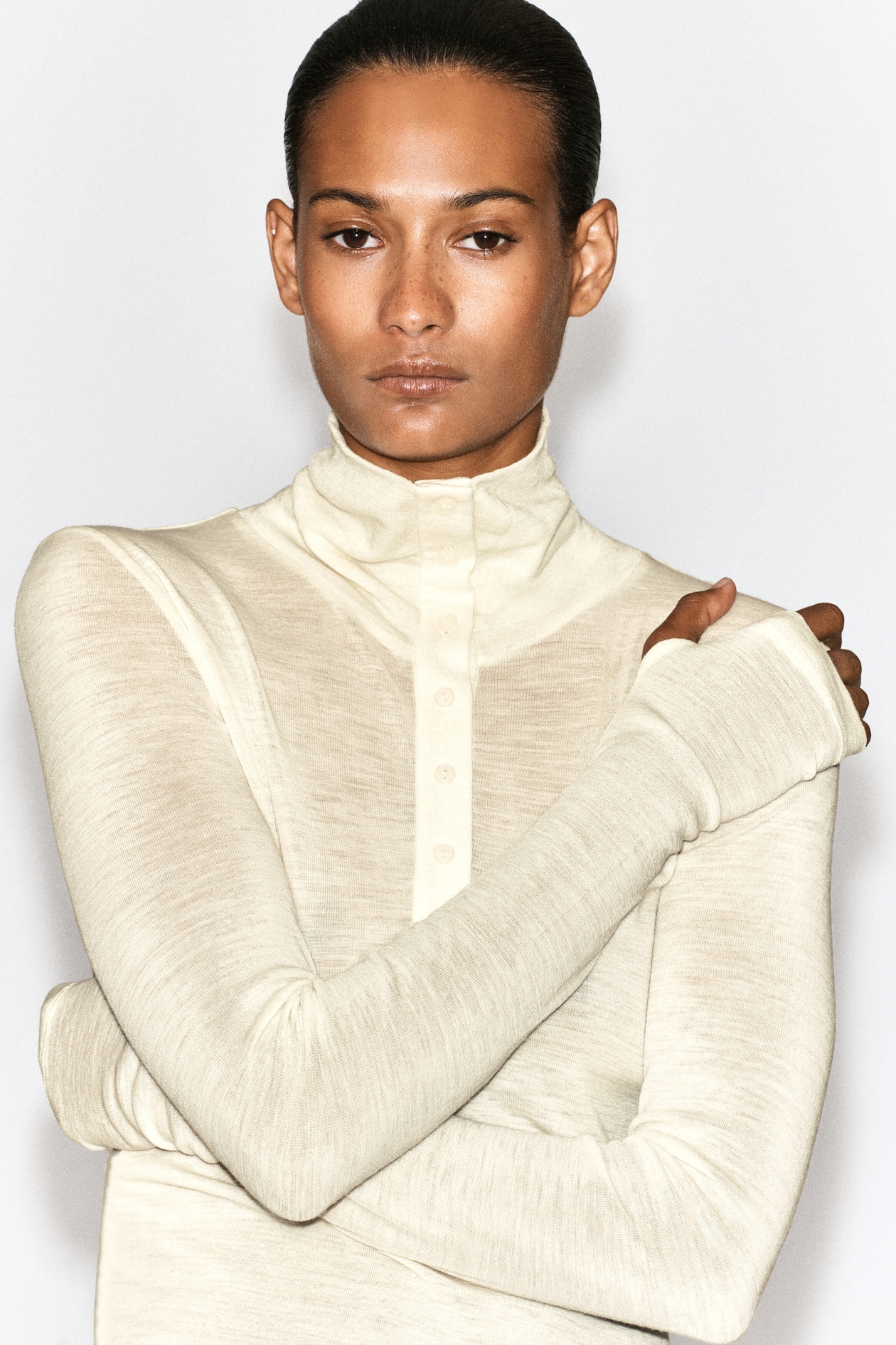 MERINO WOOL BUTTONED MOCK-NECK TOP — IVORY