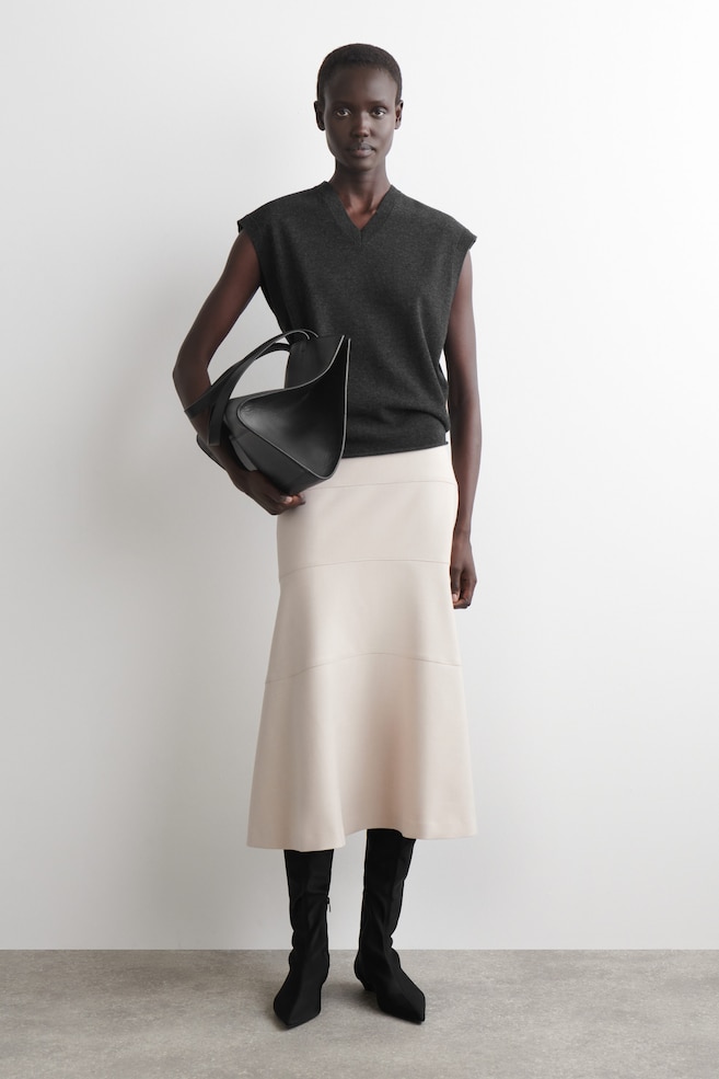 CURVED A-LINE MIDI SKIRT — LIGHT BEIGE