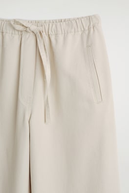 CROPPED DENIM WIDE-LEG TROUSERS — ECRU 1