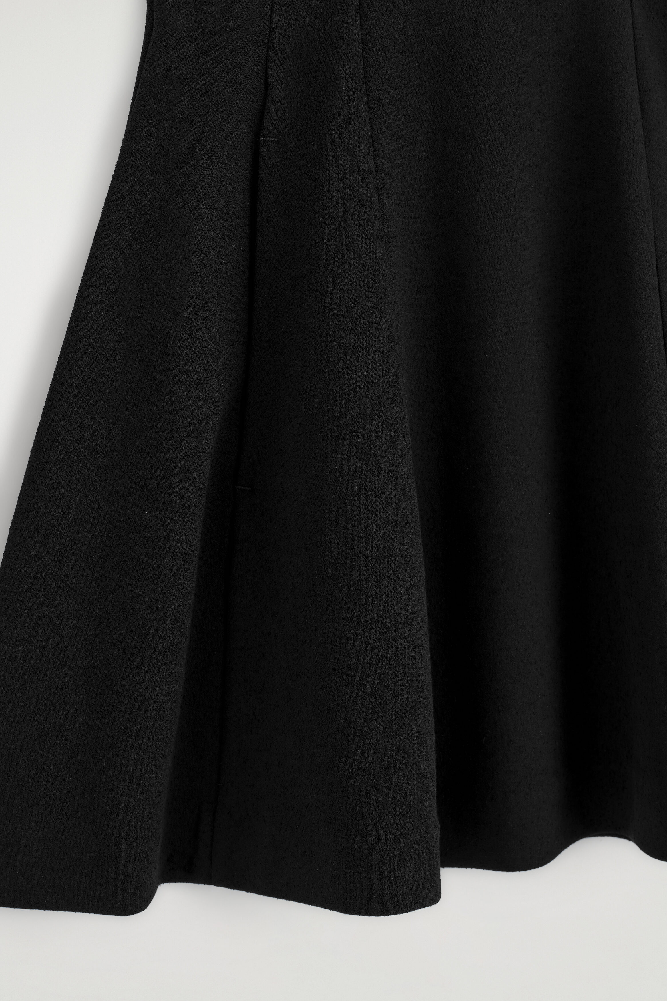SCULPTED PANELED JERSEY MINI SKIRT - BLACK | COS US