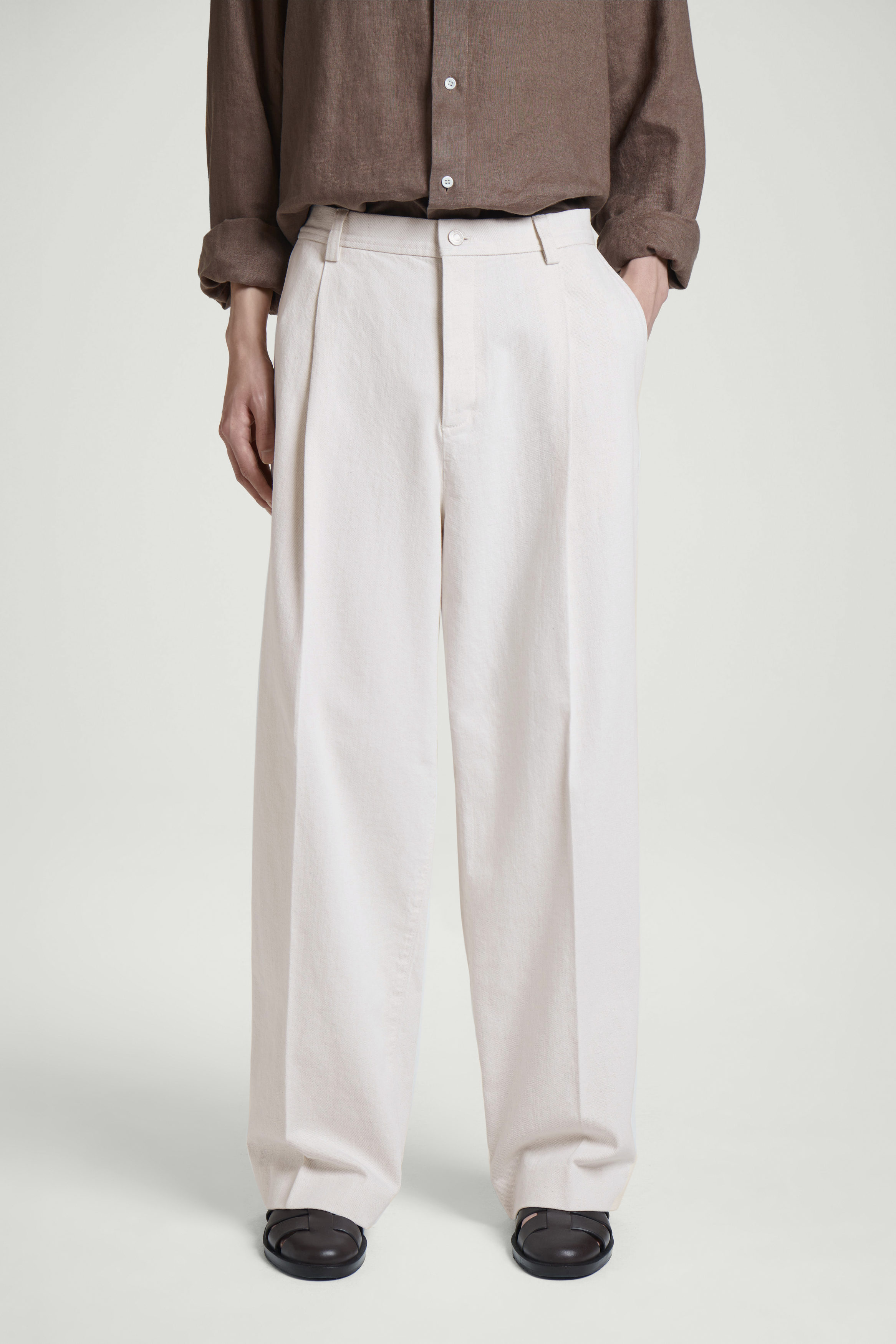 PLEATED RELAXED-FIT WIDE-LEG DENIM TROUSERS - ECRU | COS