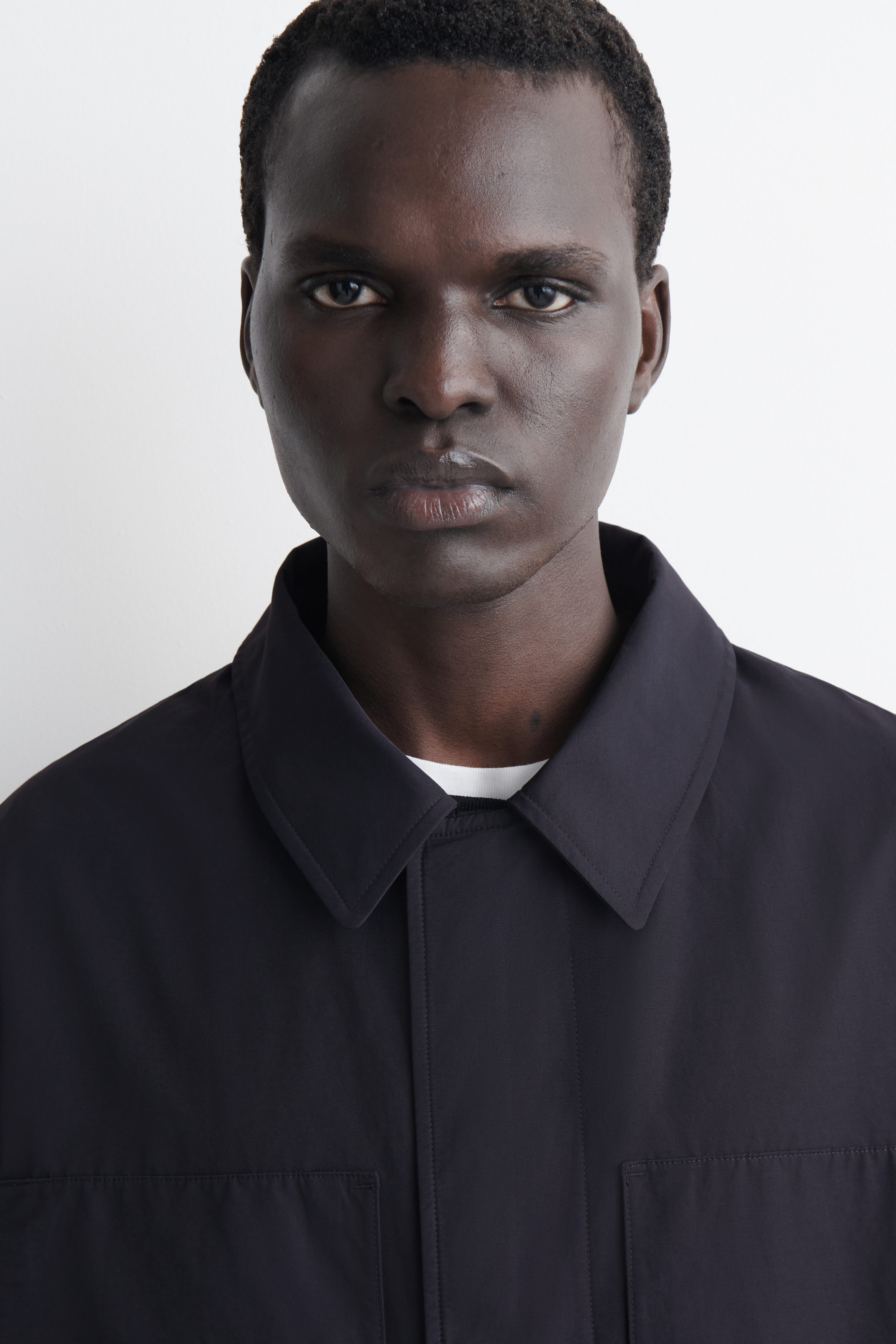 PACKABLE-HOOD WINDBREAKER JACKET - NAVY | COS US