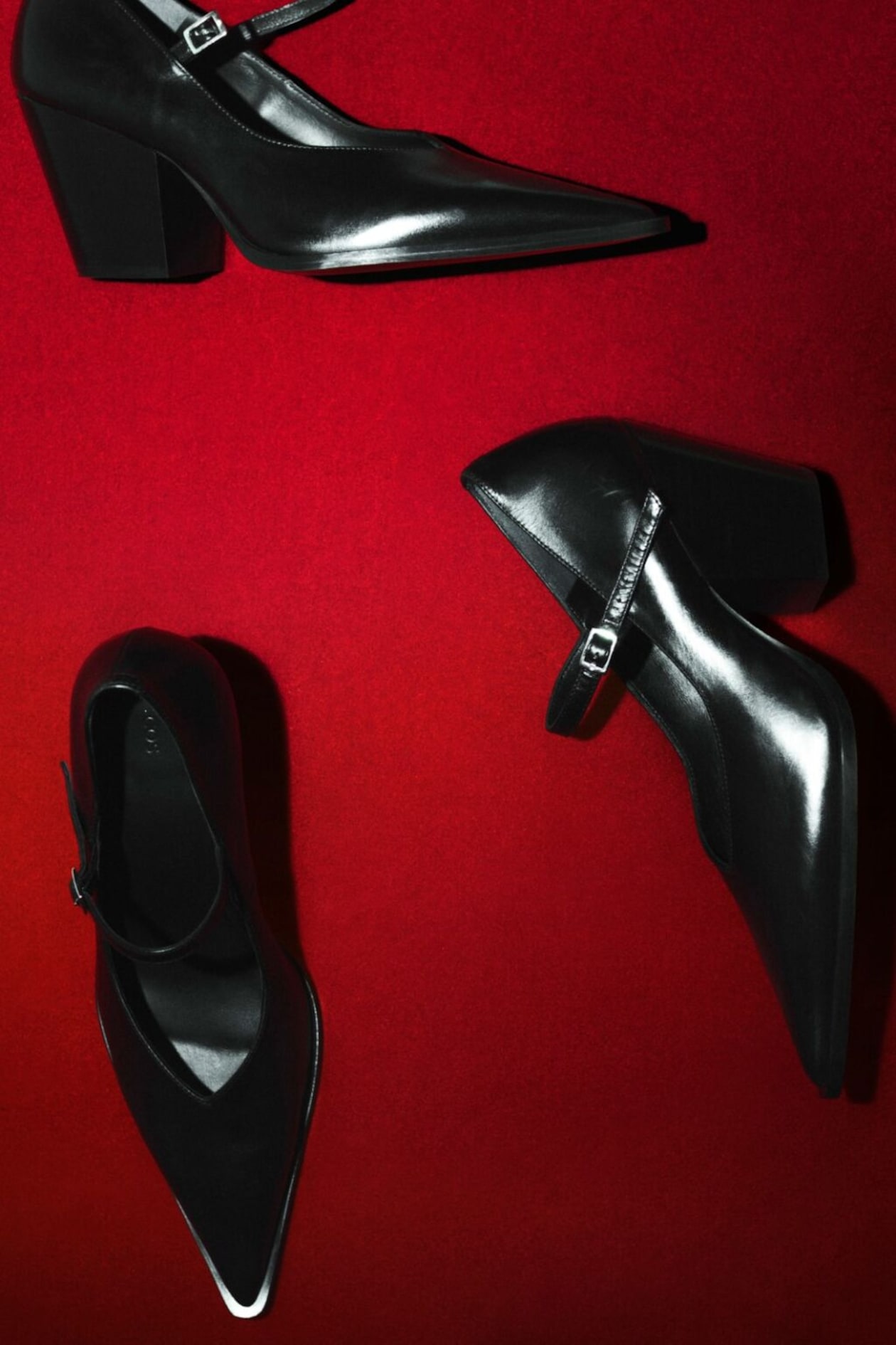 black heels on red background