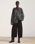 Placeholder for: woman in speckled knit cardigan