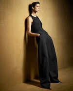 Placeholder for: Woman in black trousers and singlet top