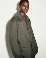 Placeholder for: man wearing green jacket