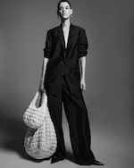 Placeholder for: model with quilted bags