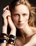 Placeholder for: Woman with mixed metal bangles