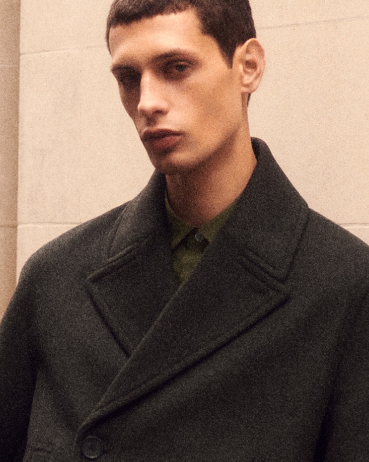 Person wearing brown jacket