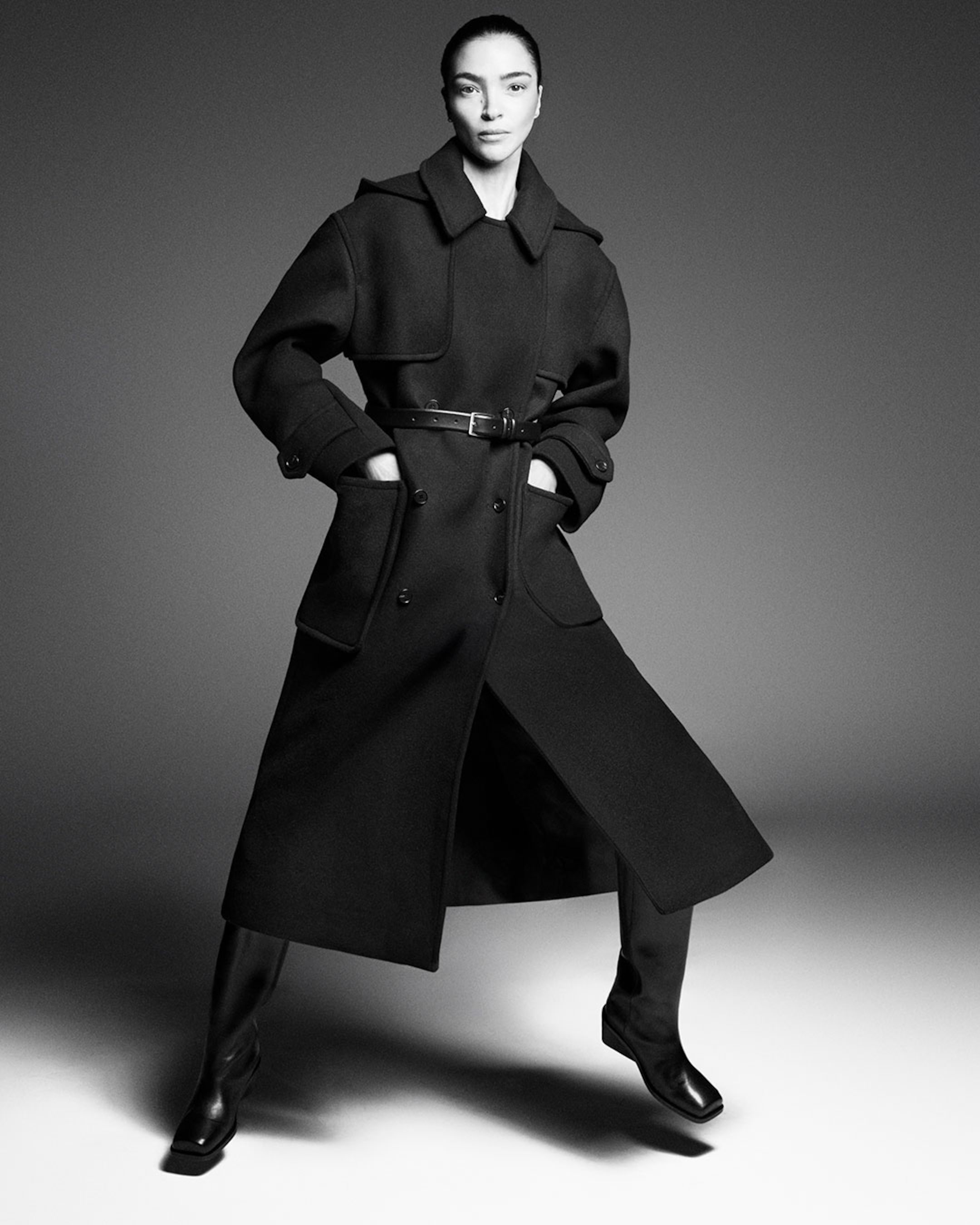 woman in black trench coat