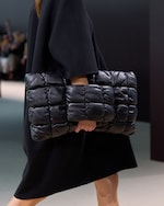 Placeholder for: Person holding bag