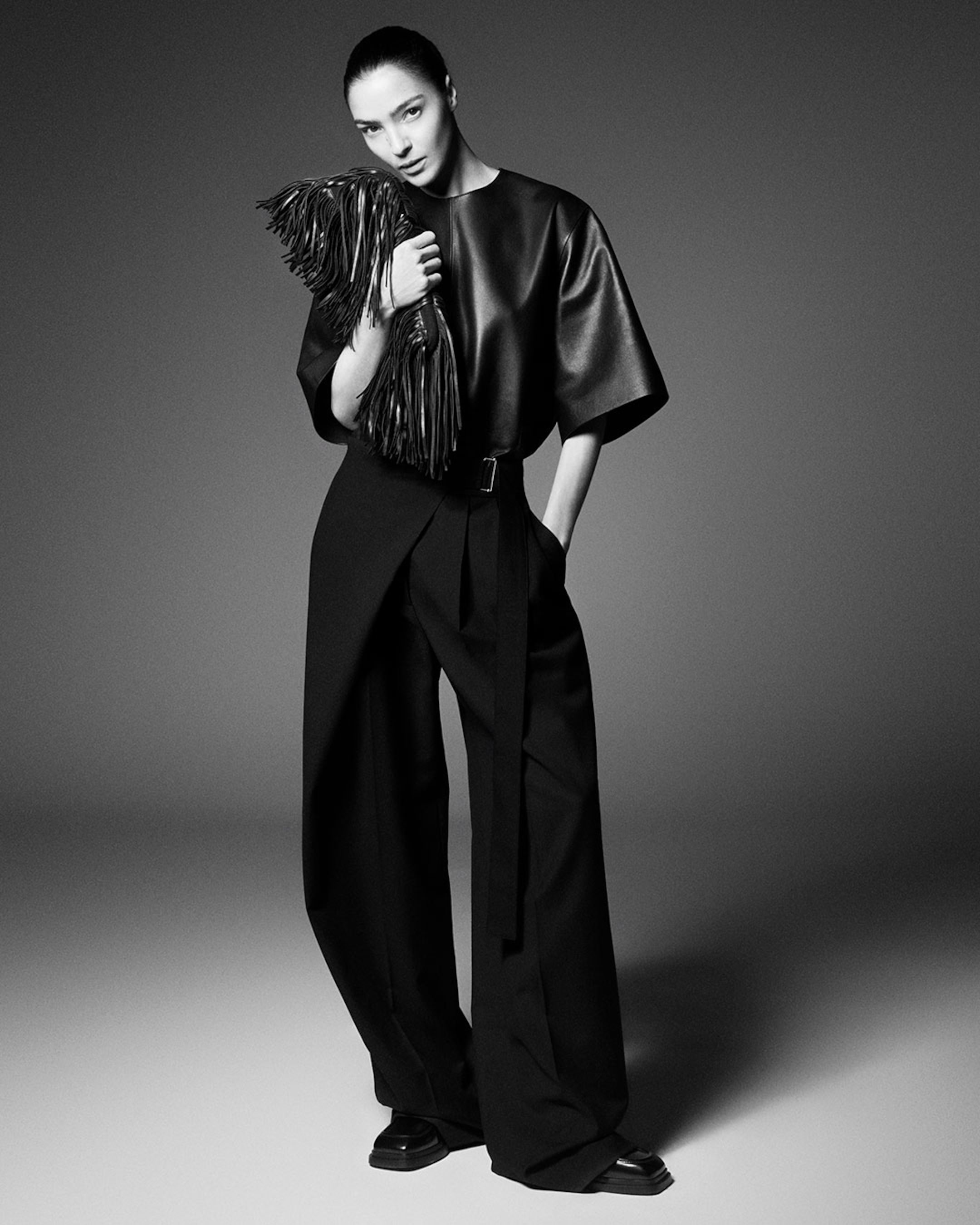 woman in wrap pants and leather top