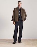 Placeholder for: man in brown jacket